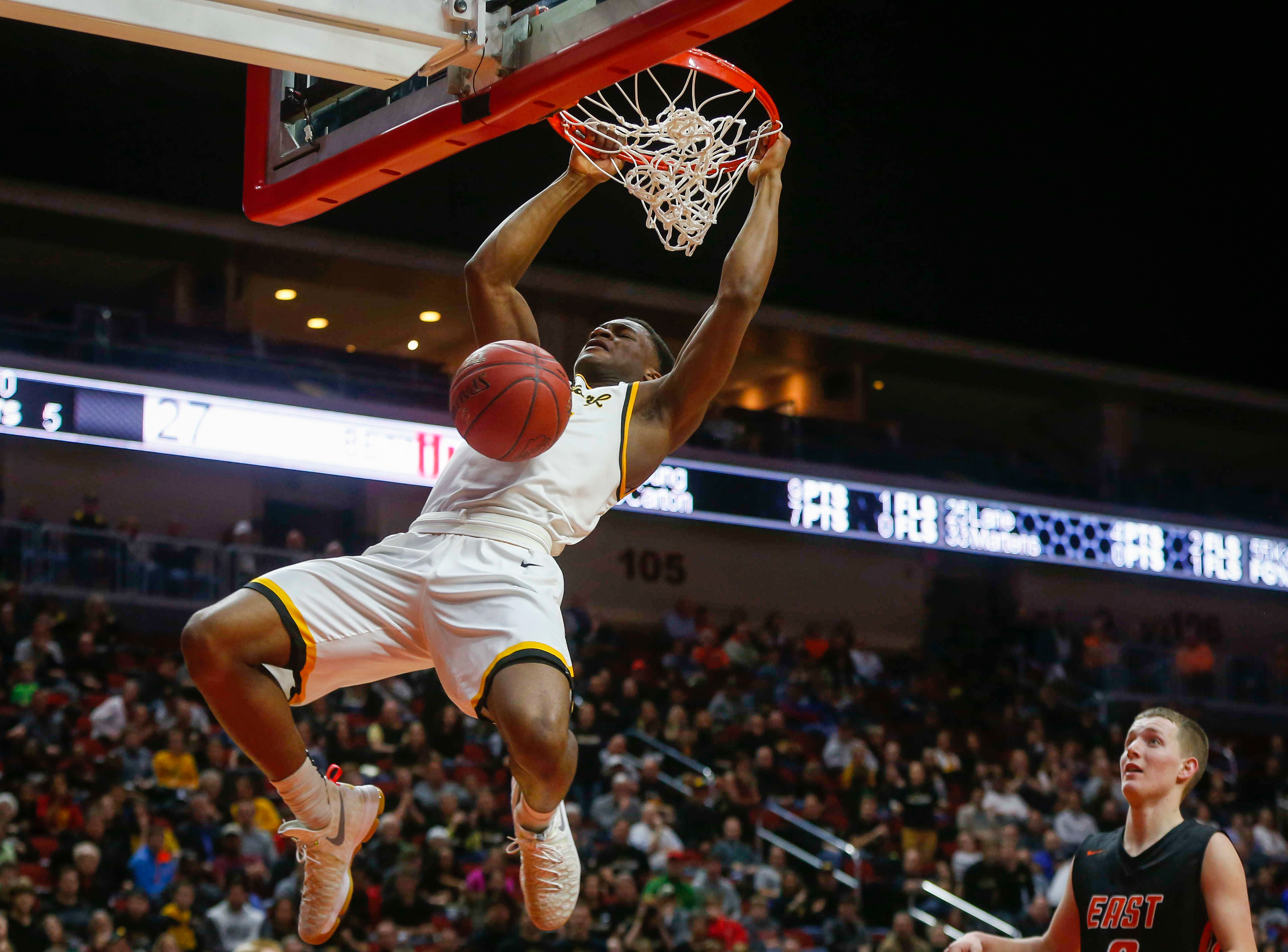 Bettendorf senior Suni Lane throws down one of his two dunks against Sioux City East during the Iowa High School state basketball tournament at Wells Fargo Arena in Des Moines on Wednesday, March 8, 2017.