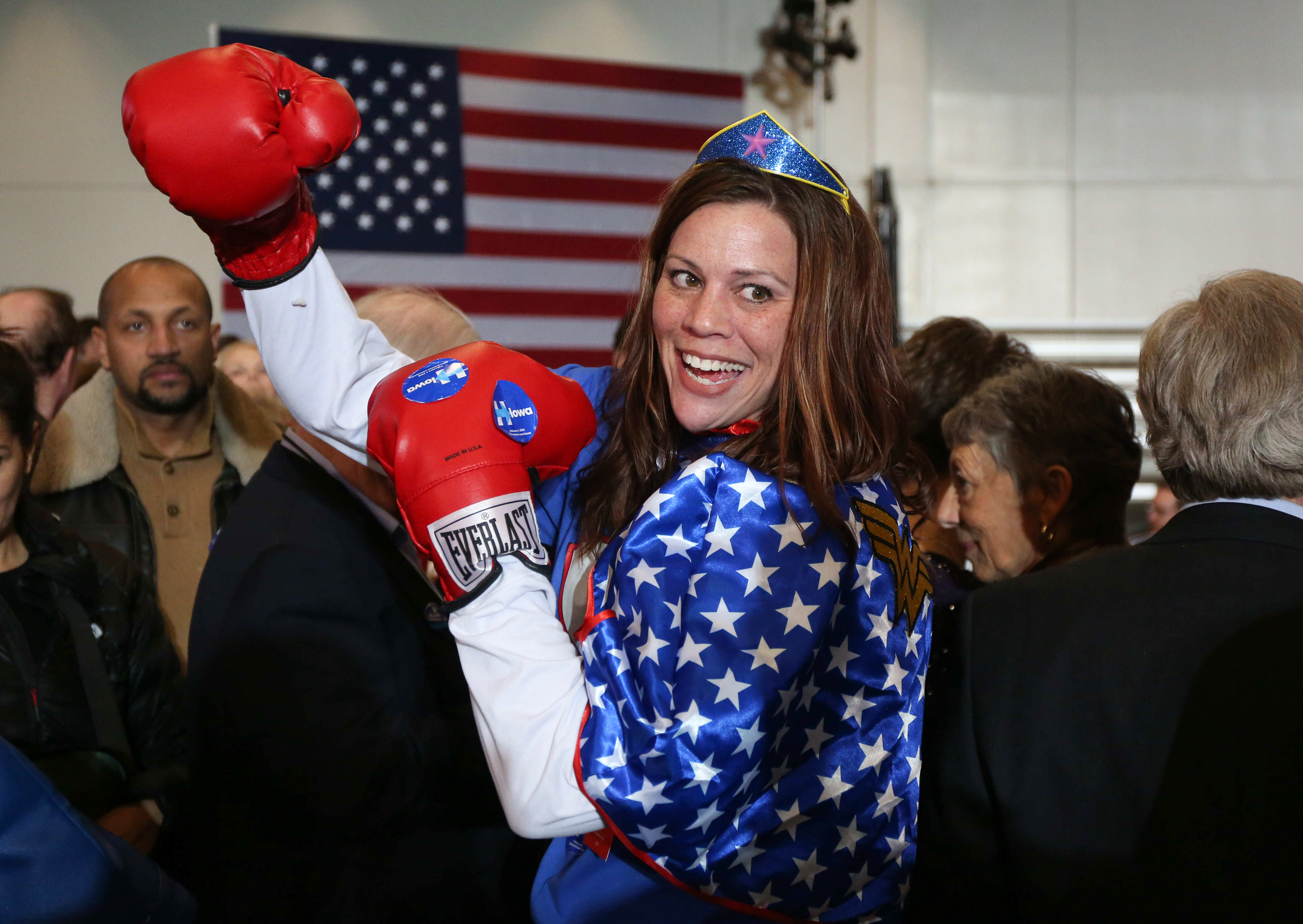 Kim Frederick, a Hillary Clinton supporter, dresses in boxing gloves and Wonder Woman attire on Caucus night at the Olmsted Center at Drake University in Des Moines, on Monday, Feb. 1, 2016.