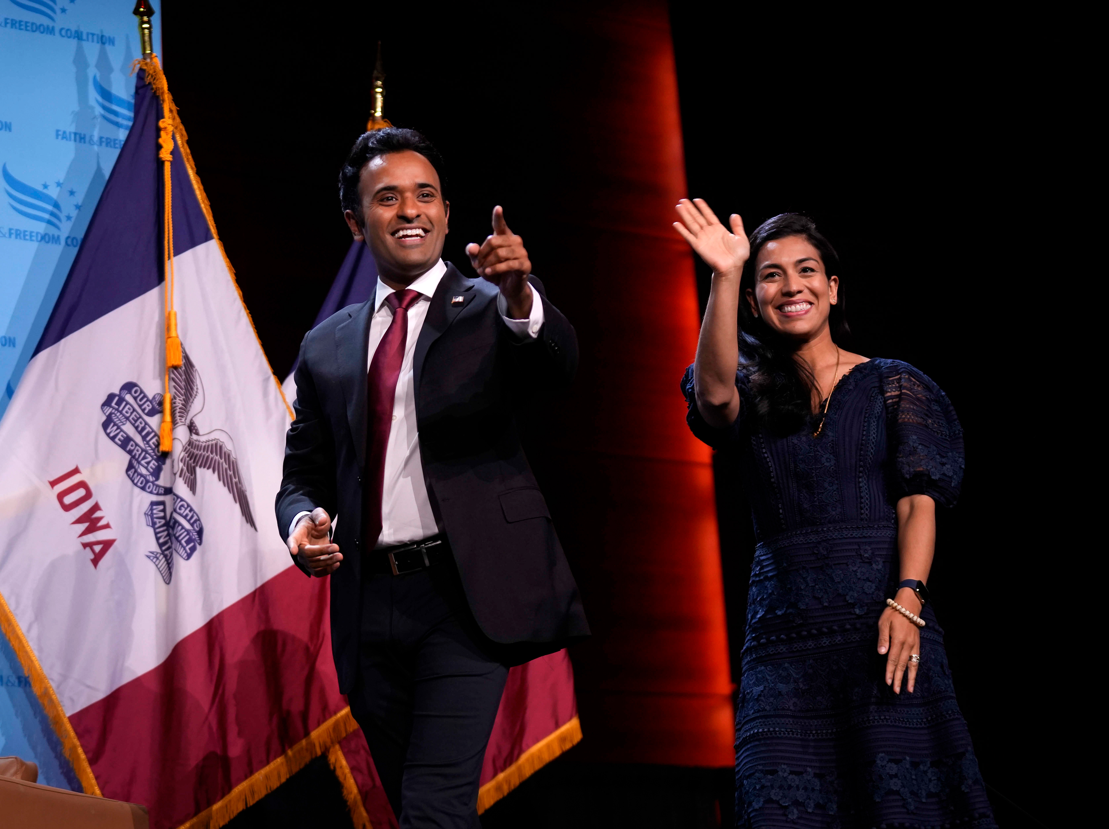 Republican presidential candidate businessman Vivek Ramaswamy is joined on stage by his wife, Apoorva Ramaswamy, before speaking at the Iowa Faith & Freedom Coalition’s fall banquet, Saturday, Sept. 16, 2023, in Des Moines, Iowa. (AP Photo/Bryon Houlgrave)