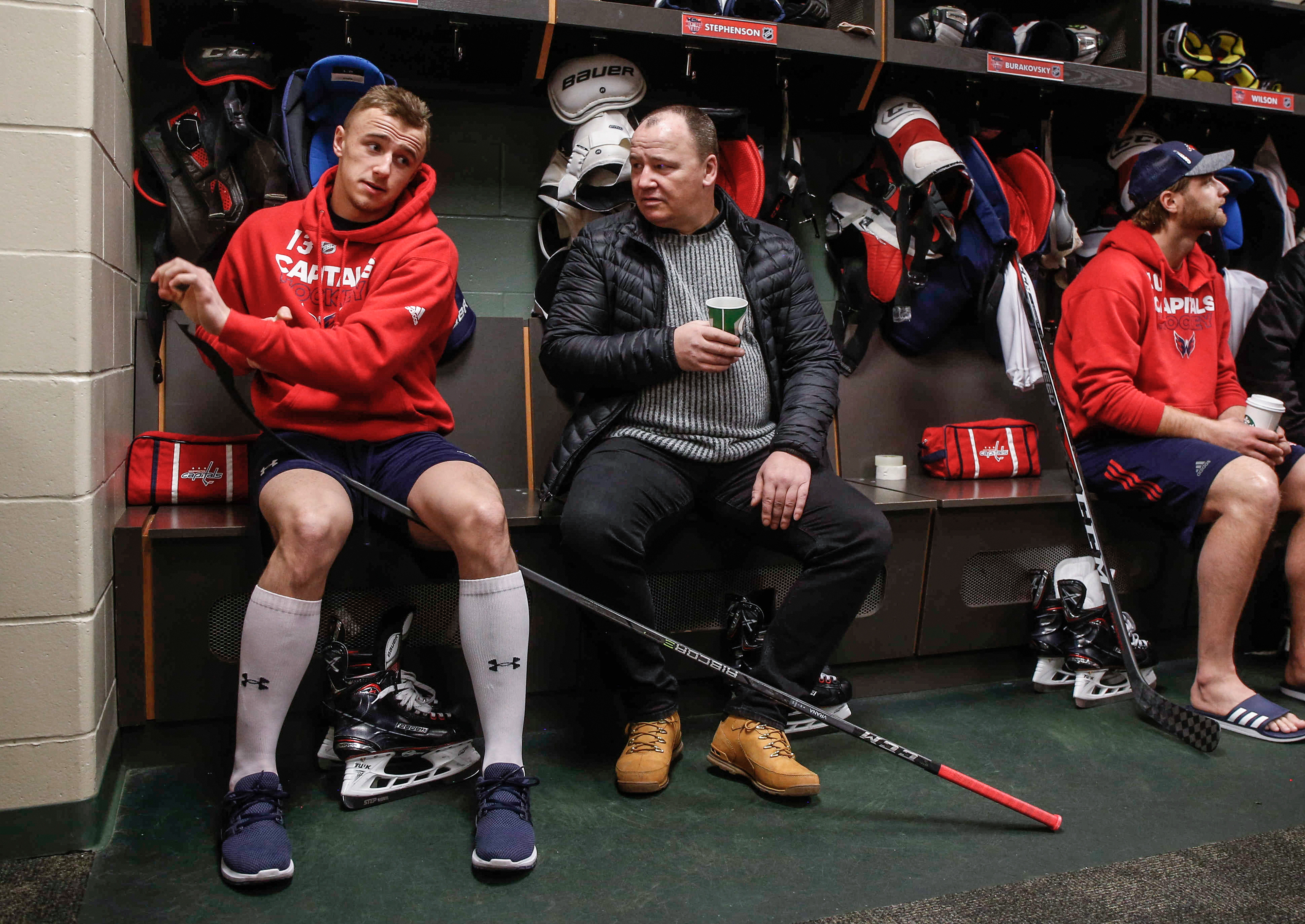 Washington Capitals left wing Jakub Vrana tapes his stick while visiting with his father, Karl, on Thursday, Feb. 15, 2018, in St. Paul, Minn., during the team's 2018 Mentors' Trip.