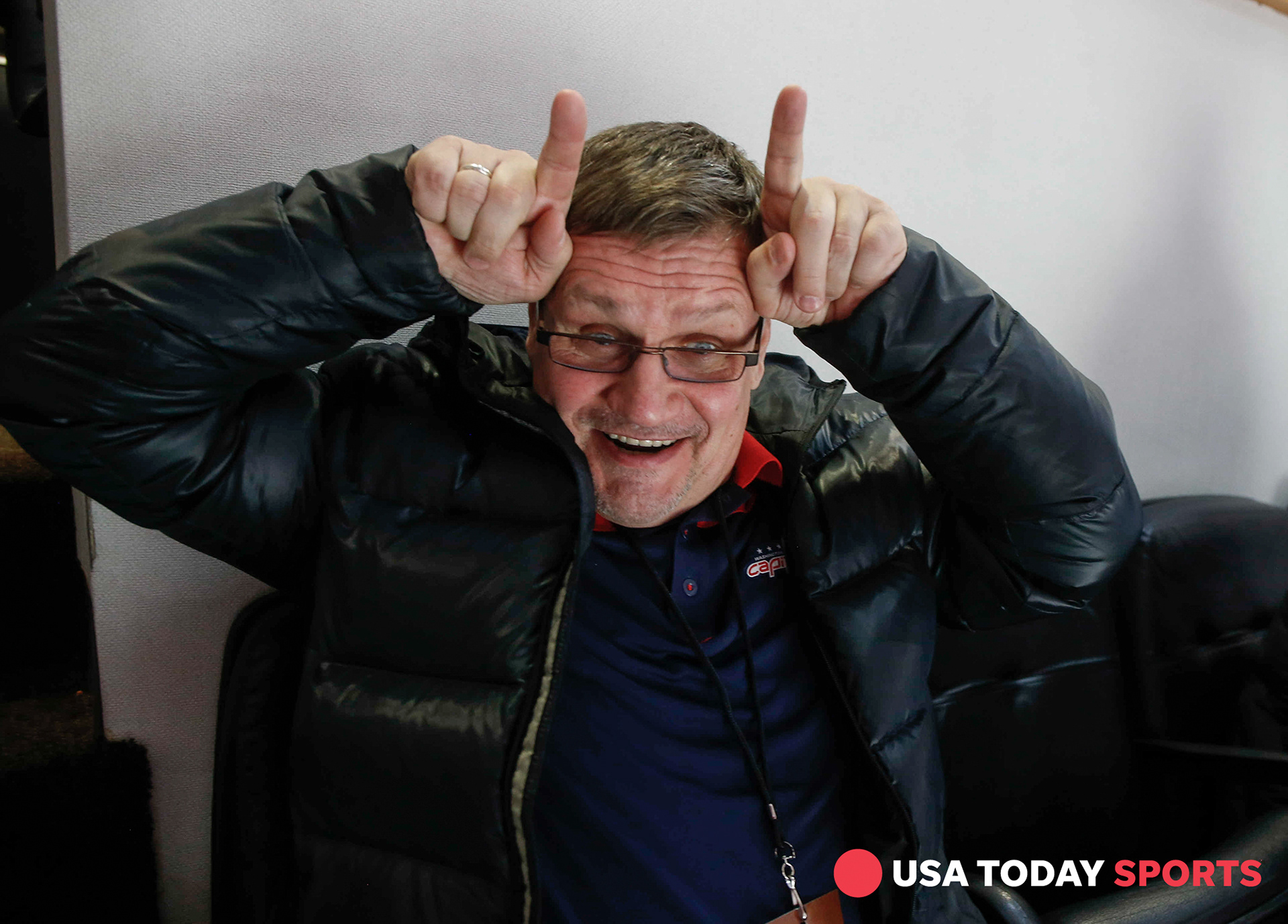 Vladimir Orlov, father of Washington Capitals defenseman Dmitry Orlov, makes a gesture while watching the Capitals game against Chicago from the luxury suites at the United Center on Saturday, Feb. 17, 2018, during the Mentors' Trip.