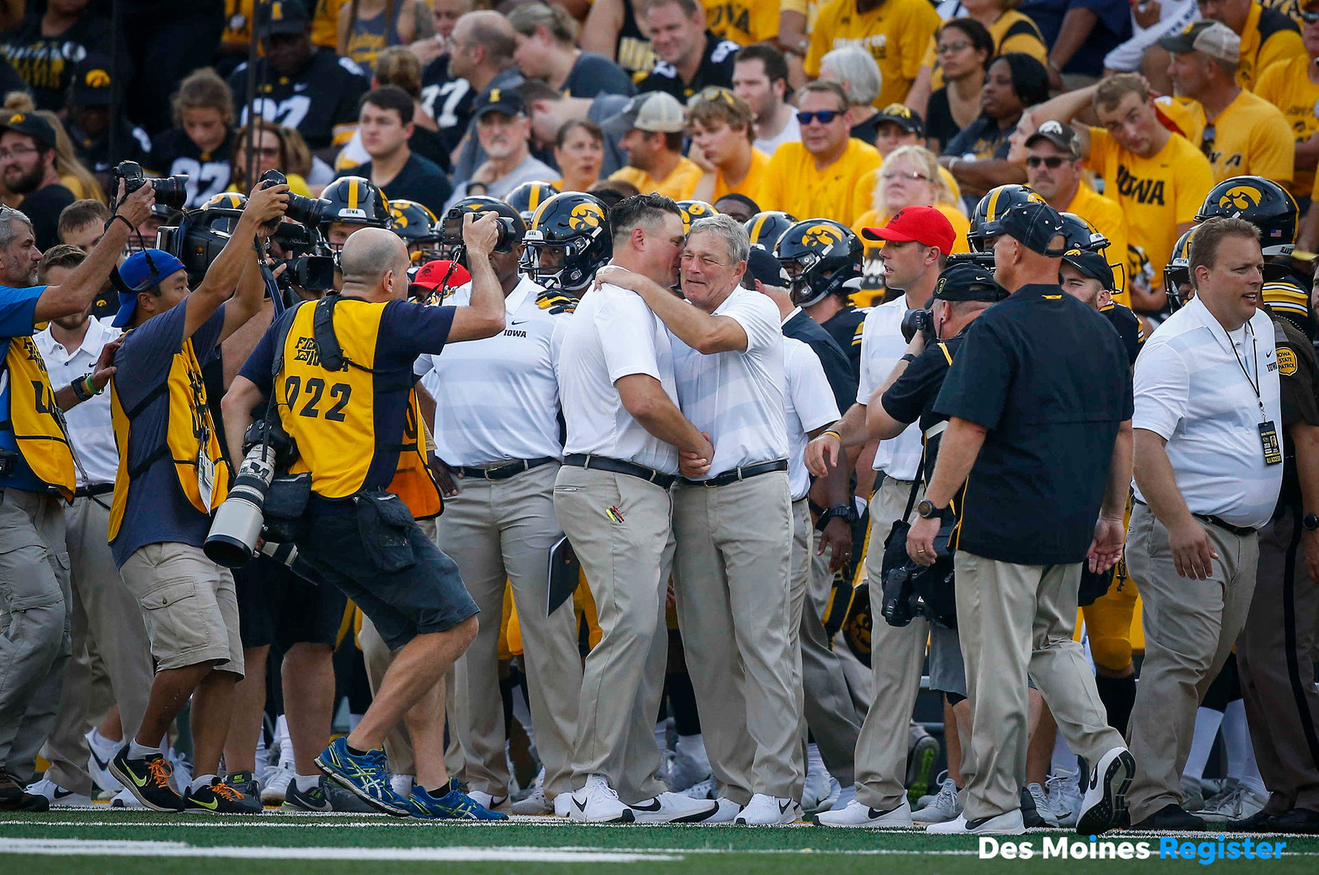 An emotional Iowa head football coach Kirk Ferentz gets a hug from his son and offensive coordinator Brian Ferentz after a 33-7 win over Northern Illinois on Saturday, Sept. 1, 2018, at Kinnick Stadium in Iowa City. The win makes Ferentz the winningest coach in Iowa football history. 