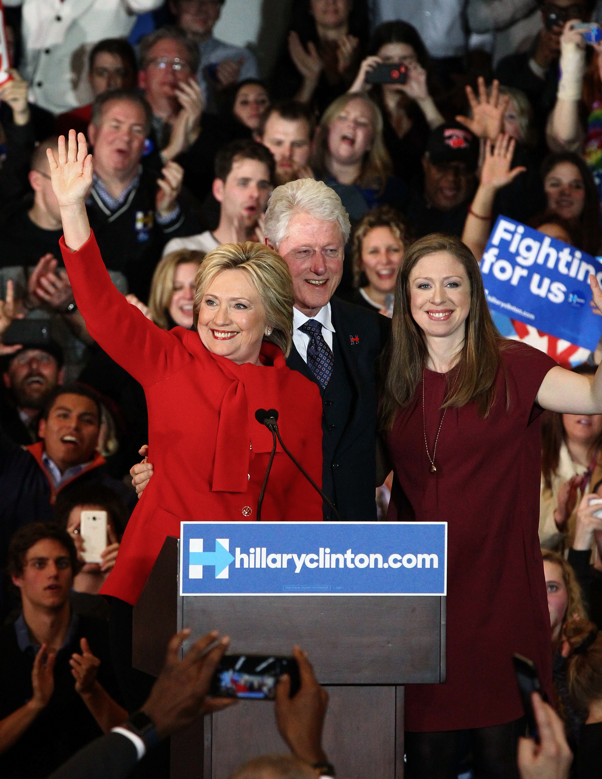 Democratic presidential candidate Hillary Clinton celebrates with her husband, former President Bill Clinton and their daughter, Chelsea, after Clinton was projected the winner over Bernie Sanders on caucus night at the Olmsted Center at Drake University in Des Moines, on Monday, Feb. 1, 2016.