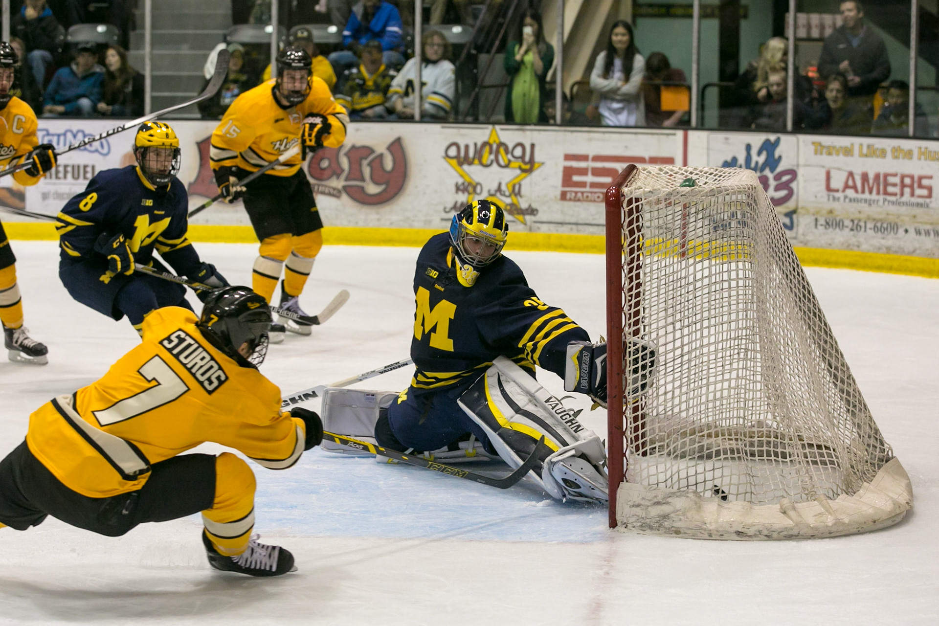 Michigan Tech scores a goal while sweeping Michigan for the first time since the 70s at the John MacInnes Student Ice Arean in Houghton, MI on 10/31/14.