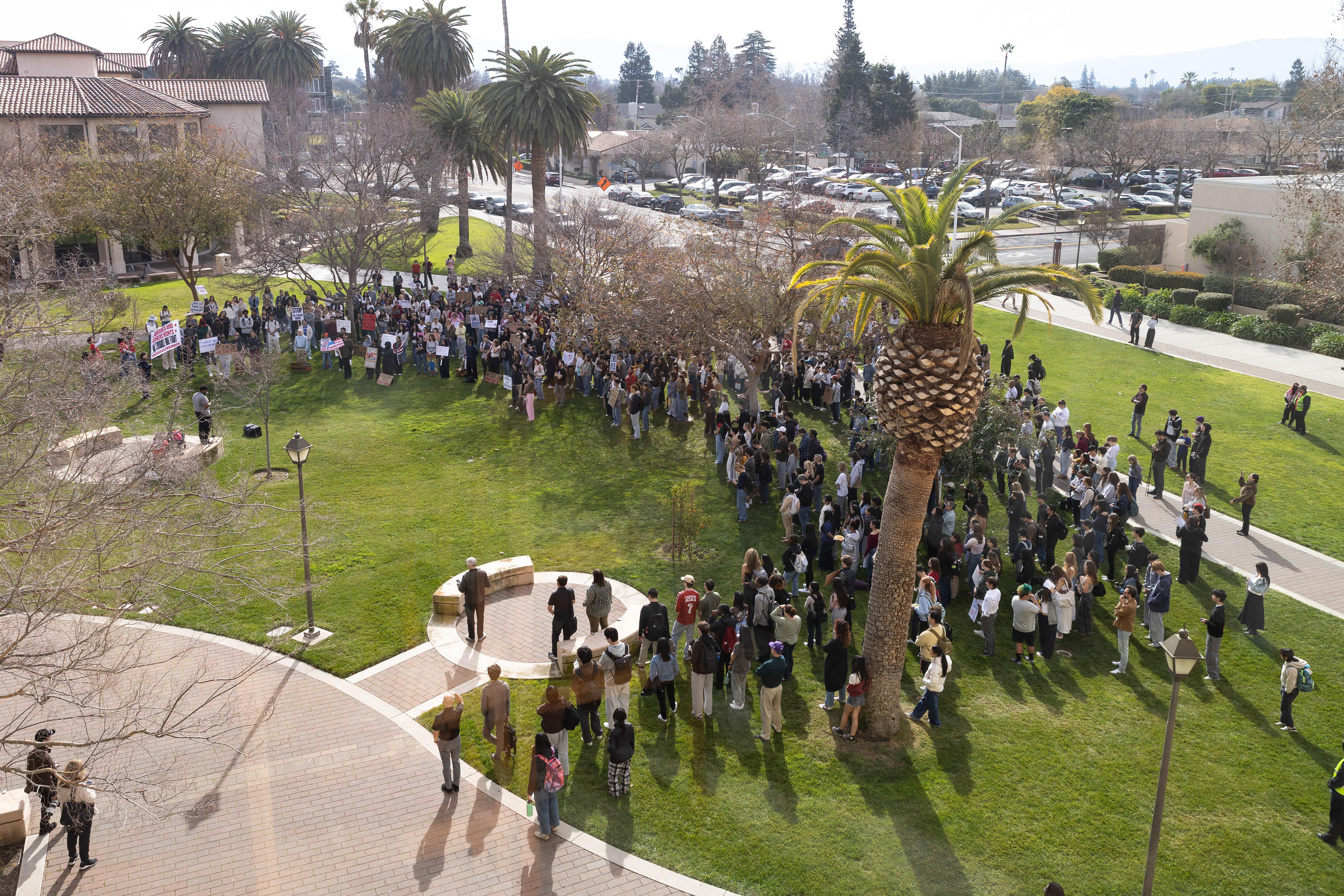A crowd listens to Elijiah Goss speak at the “ICE OUT” rally and march by the Bronco statue on the campus of Santa Clara University on Friday Jan. 30, 2026. Similar demonstrations took place around the country in support of protests in Minneapolis against ICE’s actions in Minnesota. (Nina Glick/The Santa Clara)