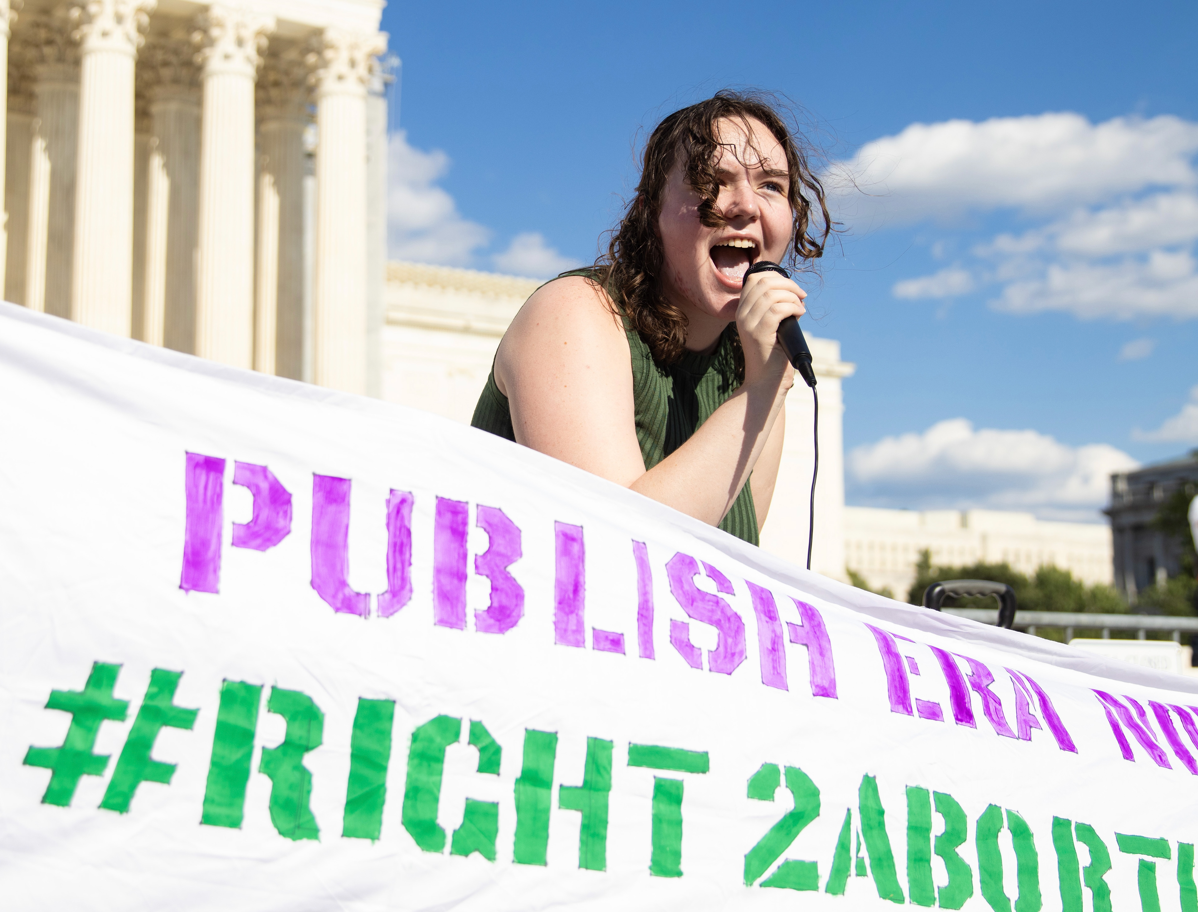 An activist with the Young Feminist Party speaks at a rally to call for President Joe Biden to publish the Equal RIghts Amendment outside of the Supreme Court on June 24, 2024.