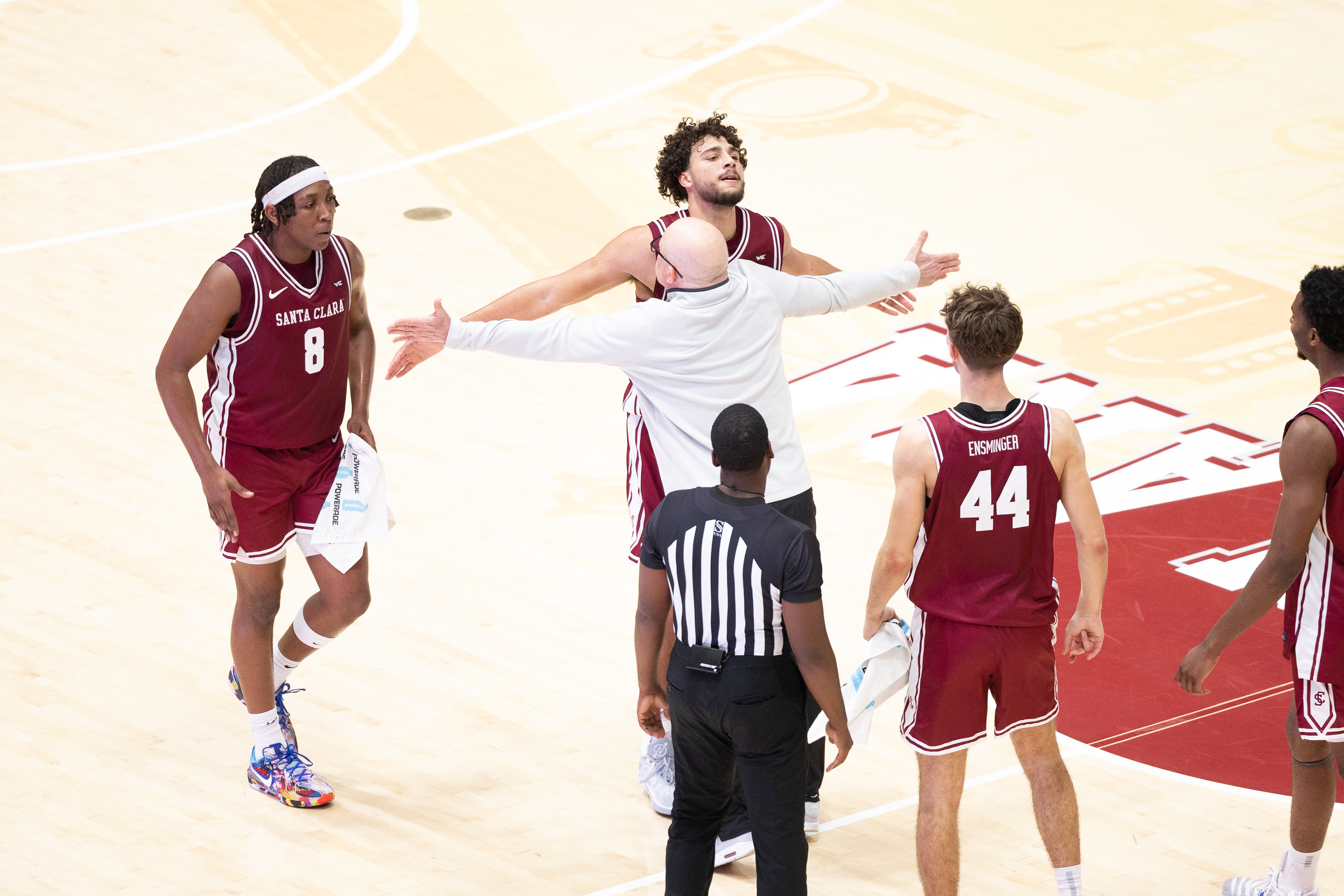 Santa Clara University men’s basketball head coach Herb Sendek chest bumps Allen Graves after Graves made a three-pointer. (Nina Glick/The Santa Clara)