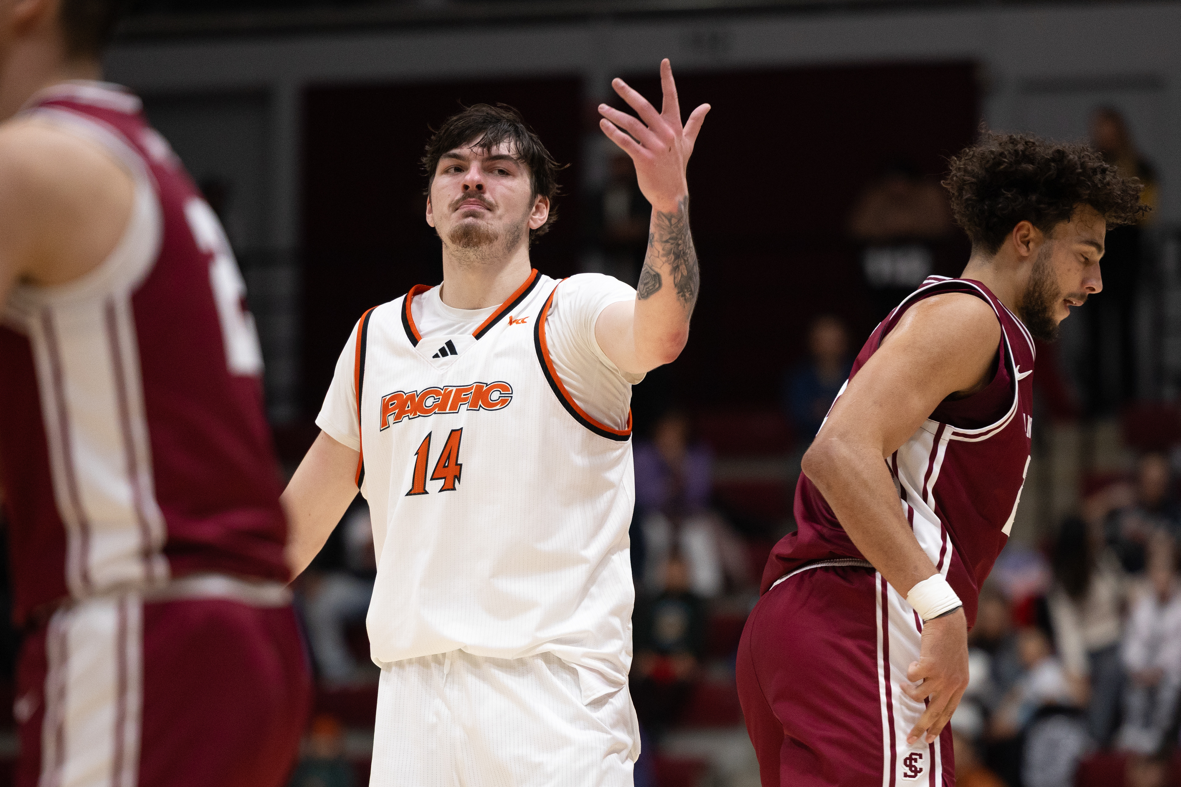 Pacific’s Isaac Jack (14) throws his hand up after Allen Graves scored a three-pointer while he was defending him. (Nina Glick/The Santa Clara)