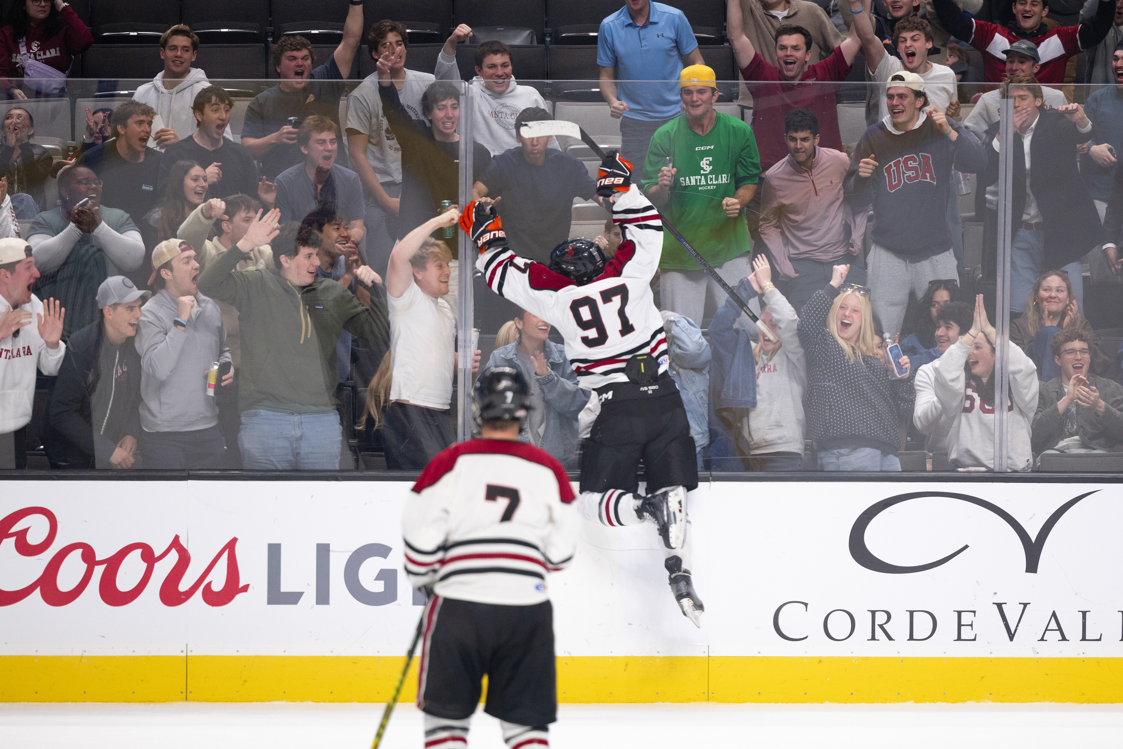 Santa Clara club hockey player William Welch ’29 (97) leaps toward adoring Bronco fans after scoring his second goal to cut the Spartan’s lead to 6-5 at the SAP Center on Saturday, Jan. 30, 2026. (Nina Glick/The Santa Clara)