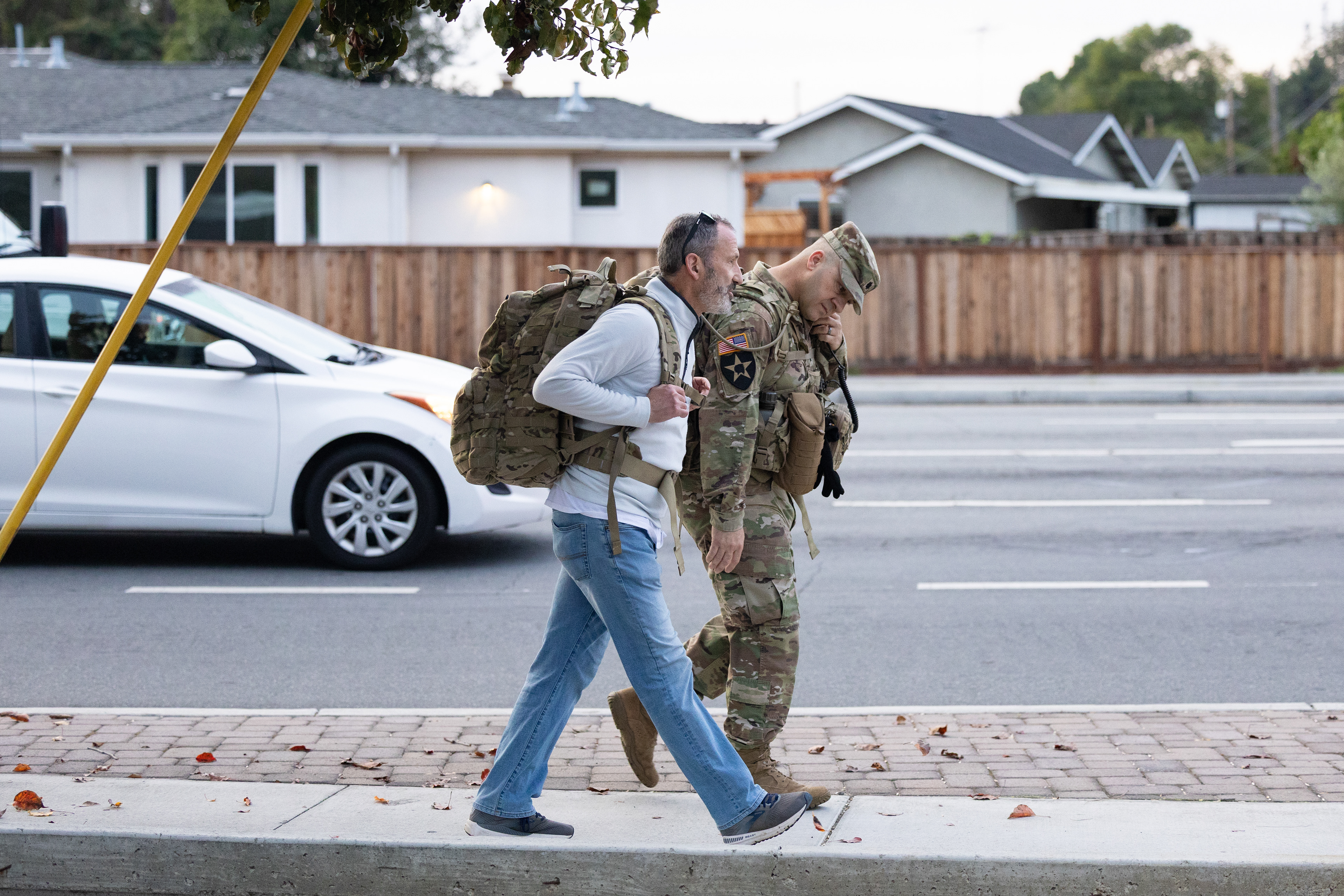Santa Clara University Provost and Executive Vice President James Glazer rucks with Lieutenant Colonel David Von Bargen, director of the military science program at Santa Clara University and 45 Army ROTC cadets from the Bronco Battalion on Veterans Day, Tuesday, Nov. 11, 2025. They rucked five miles from Santa Clara University’s campus to the City of Santa Clara Veterans Memorial and back. (Nina Glick/The Santa Clara)