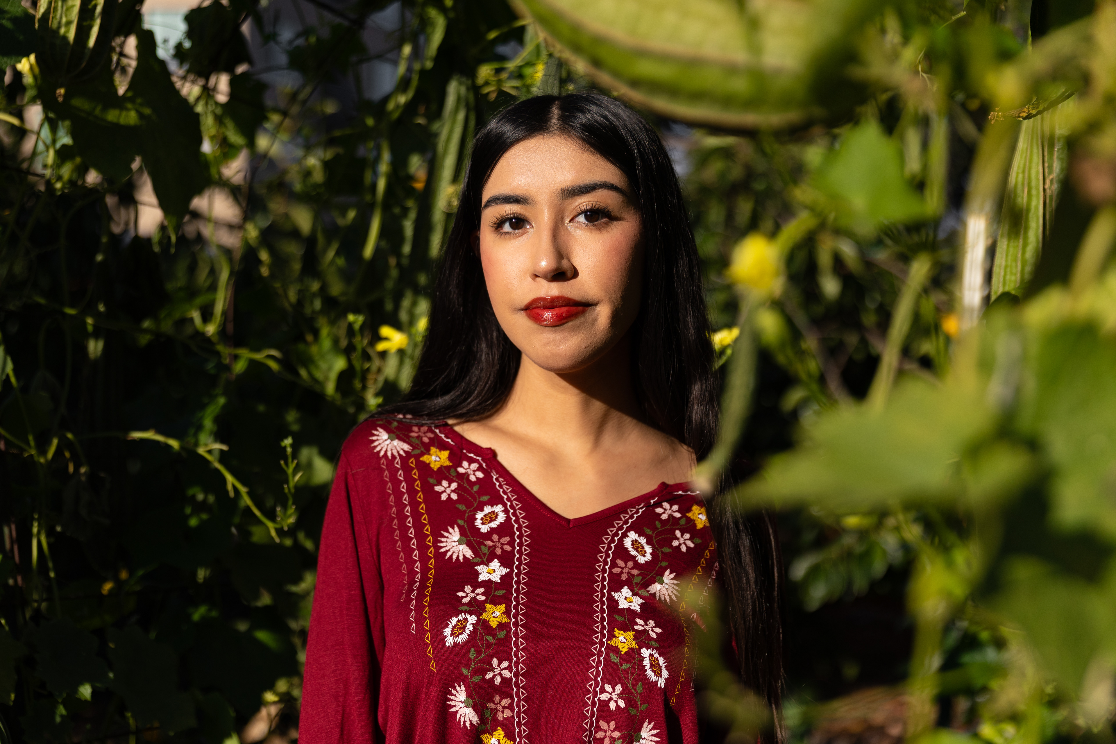 Isabella Gomez ’27, a California Native and member of the Muwekma Ohlone Tribe, the first from her tribe to attend Santa Clara University and the inaugural recipient of the University's Ohlone and Muwekma Ohlone Scholarship, at the Forge Garden. Gomez takes Muwekma Ohlone youth to the Forge’s Ohlone Native Plant Garden during the Ohlone Cultural Youth Camp at Santa Clara University. (Nina Glick/The Santa Clara)