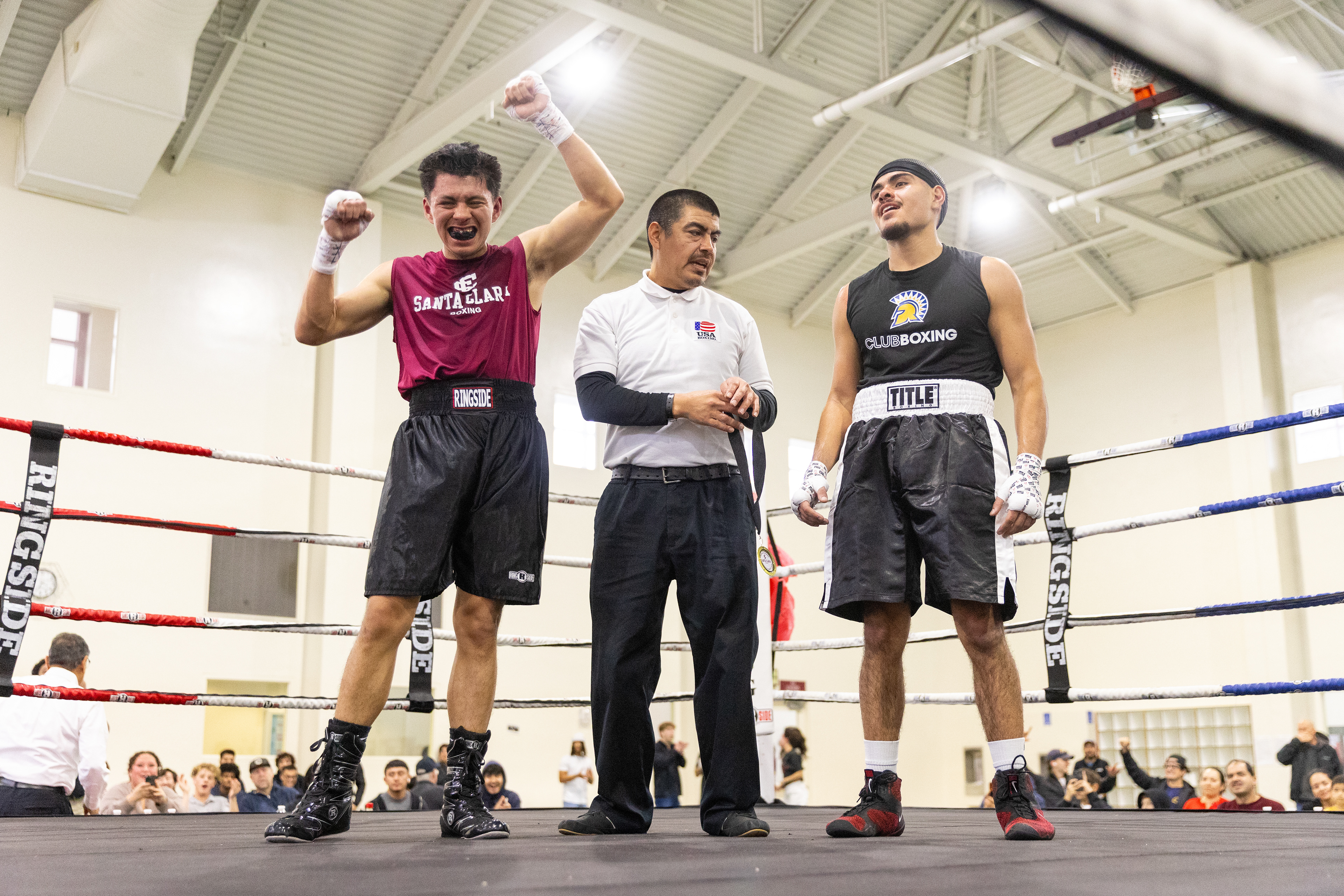 Santa Clara club boxer Jason Portales ’29 (left) celebrates his first-ever boxing win at the 2026 Dodge Ackerman Memorial Bouts at the Malley Center in Santa Clara, Calif on Sunday, Feb. 15, 2026. (Nina Glick/The Santa Clara) 