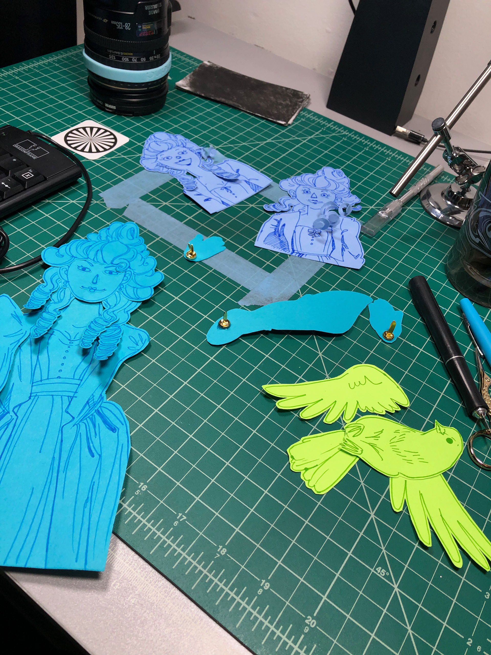 jointed paper puppets being assembled