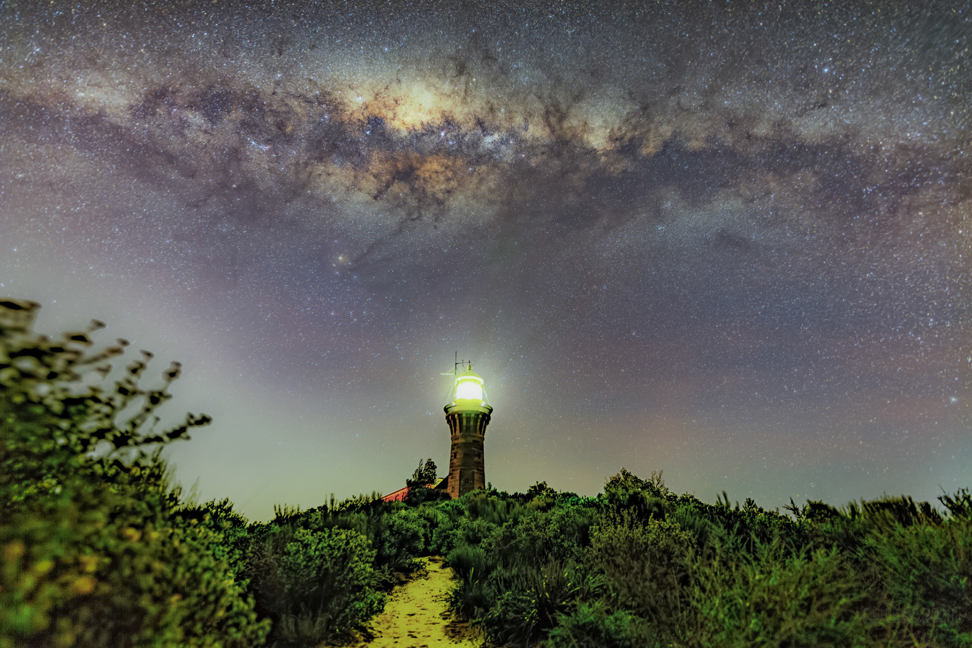 Milky Way arching over Barrenjoey Lighthouse