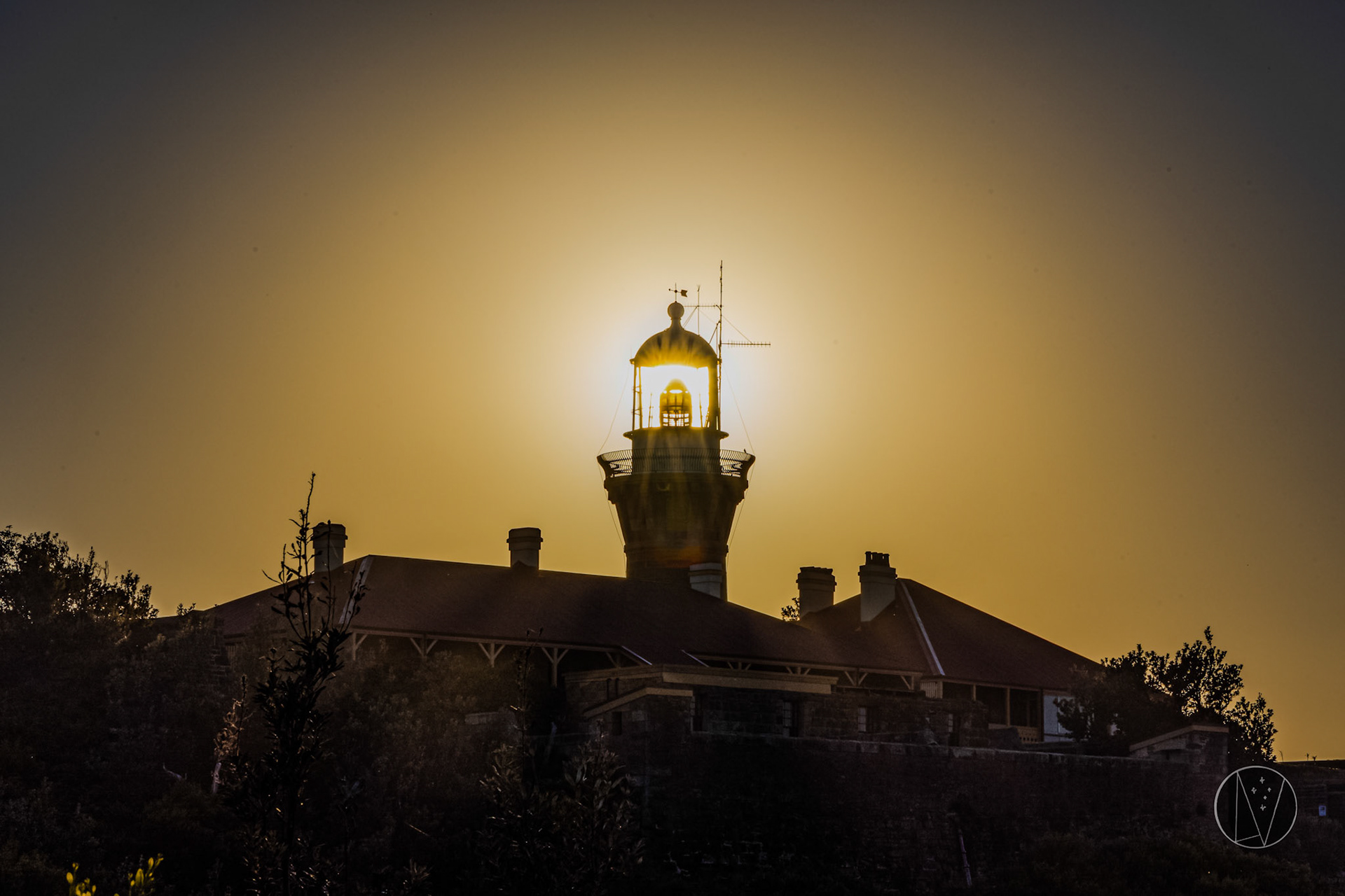 The sun behind Barrenjoey Lighthouse