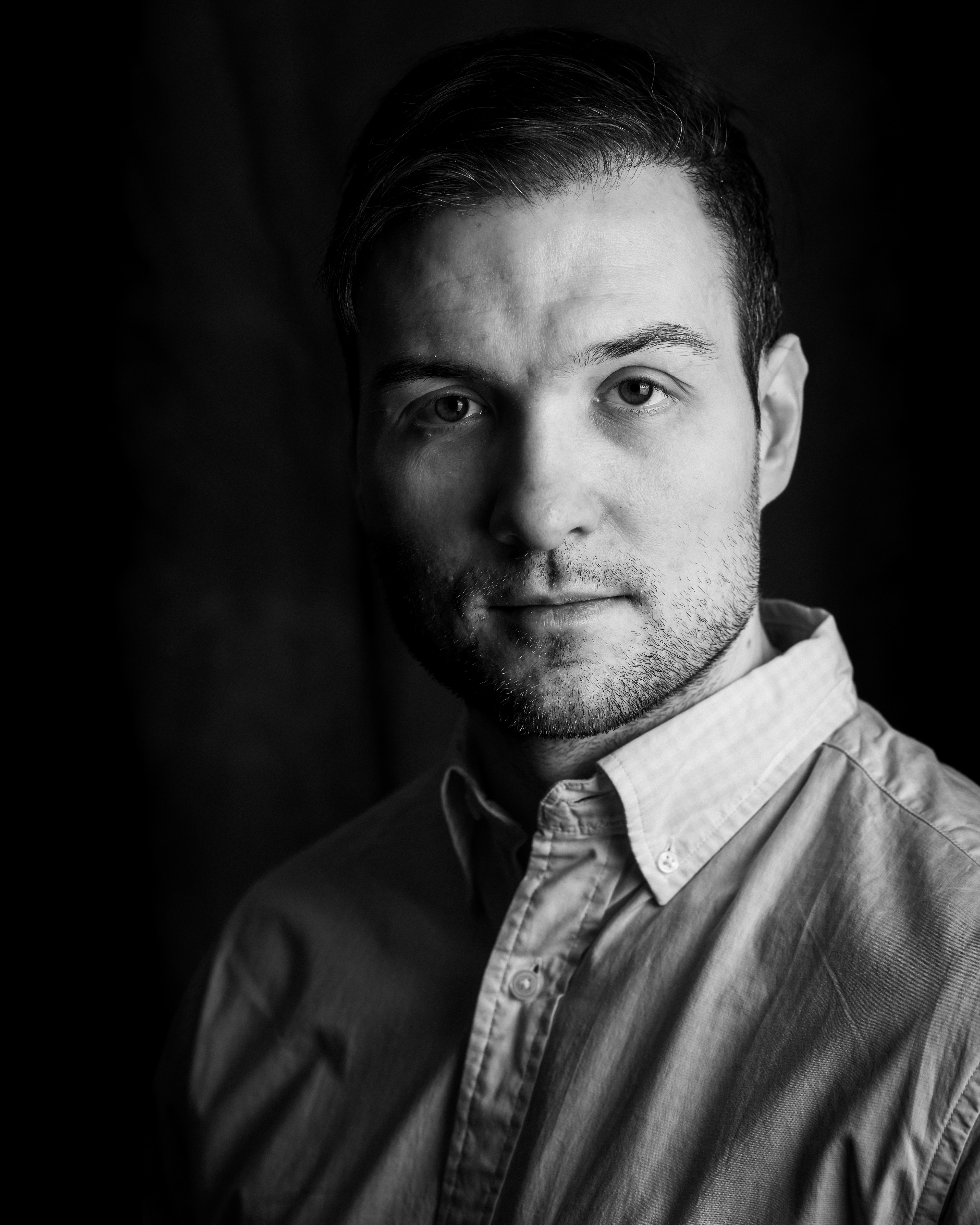 Professional black-and-white portrait of a man.