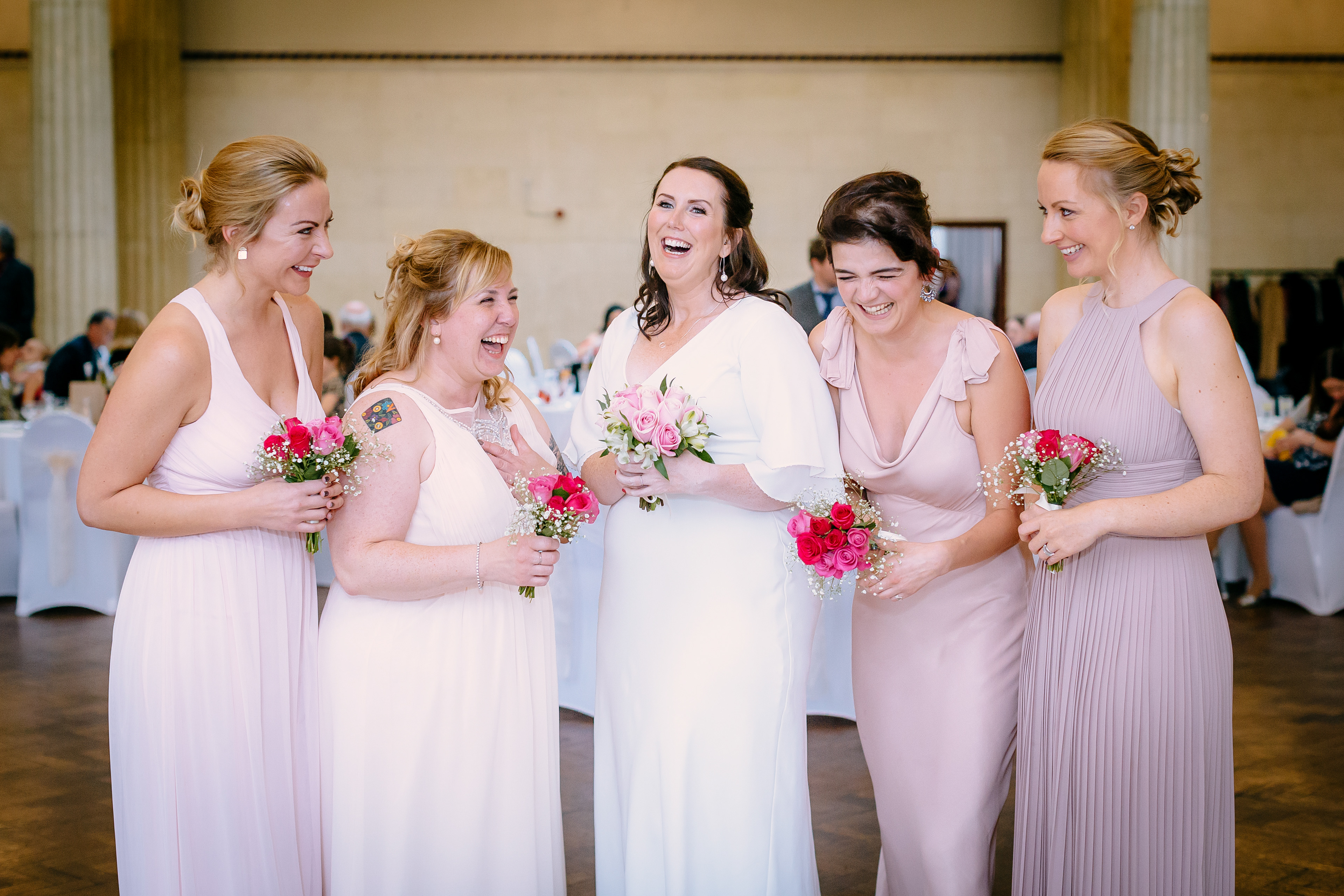 The bridal party laughing during the wedding group shots