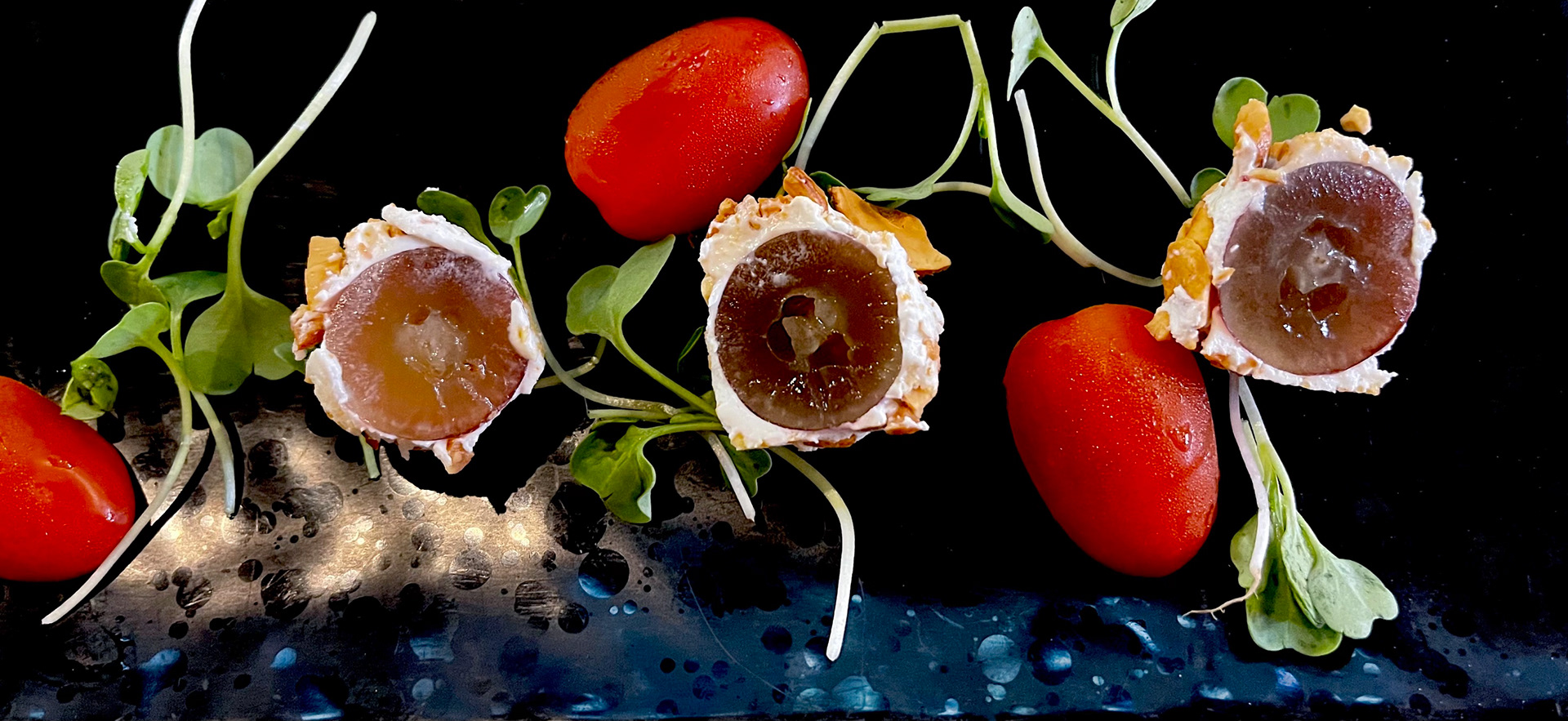 Grapes wrapped in goat cheese and cashews