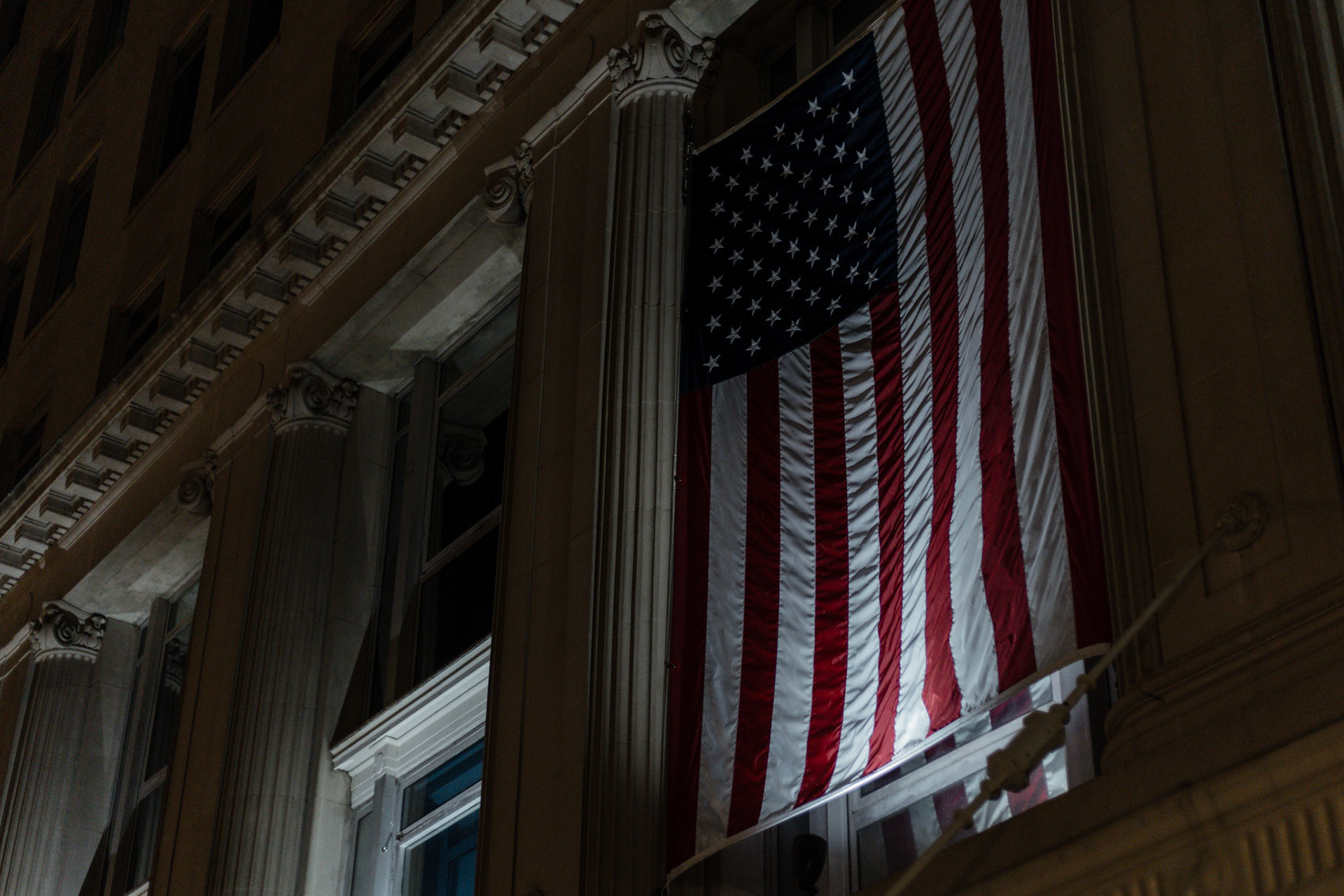 An American flag hangs from the Department of Veteran Affairs headquarters in Washington, D.C. on Jan. 28, 2026. Four days prior, federal immigration agents shot and killed Alex Pretti, an intensive care nurse at a Minneapolis VA hospital.