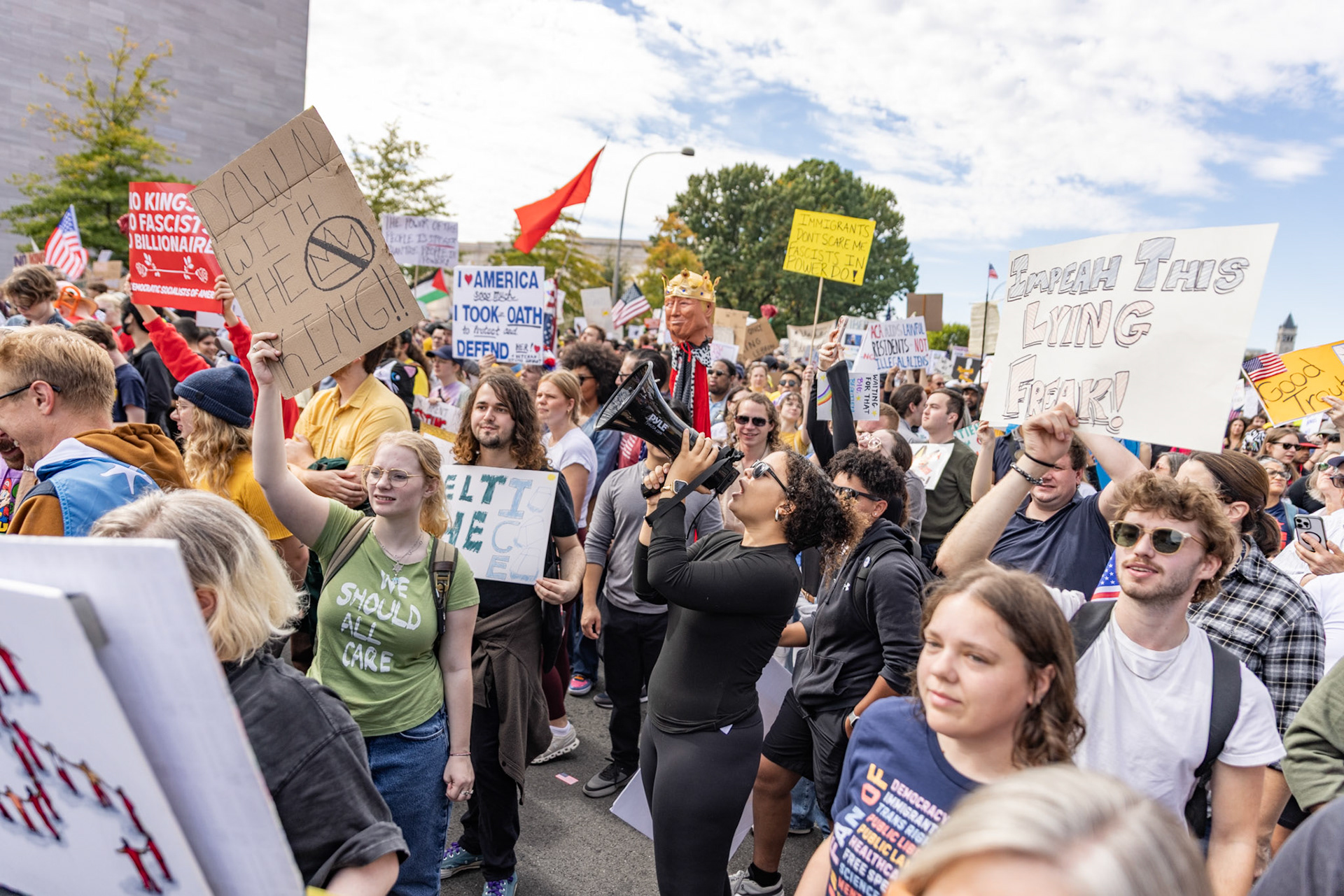 A protestor leads the crowd in chants at the No Kings protest in Washington, D.C. on Oct. 18, 2025. Over 7 million people across the country marched against recent actions by President Trump, from the immigration crackdown to the general state of the economy.