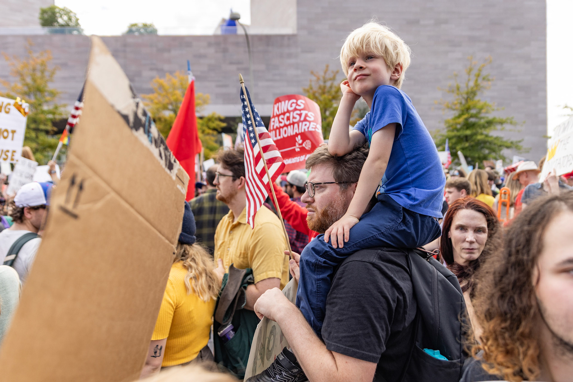 Perched on his father’s shoulders, a child looks around while marching in the No Kings protest in Washington, D.C. on Oct. 18, 2025. Over 7 million people across the country marched against recent actions by President Trump, from the immigration crackdown to the general state of the economy.