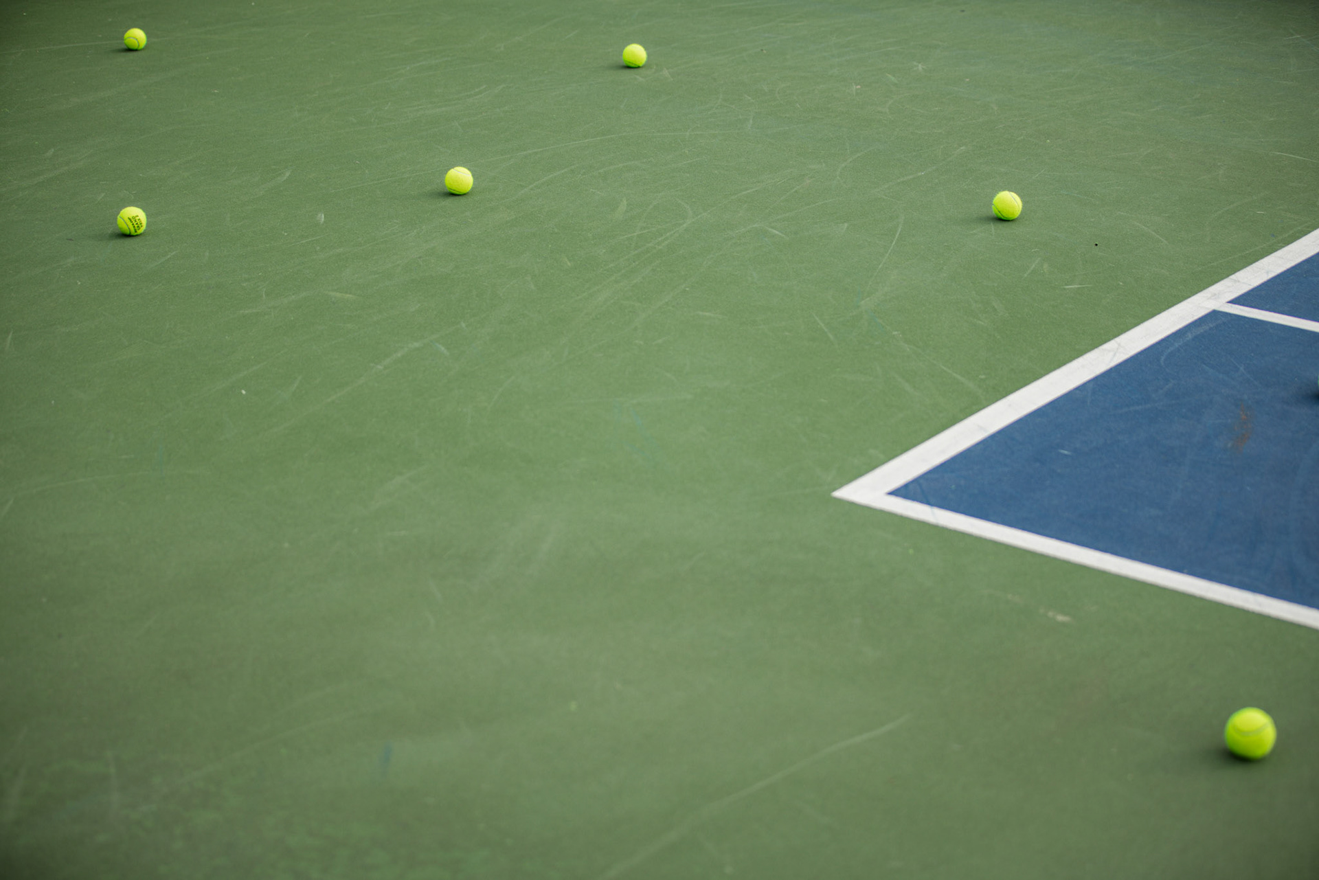 COLLEGE PARK, MARYLAND - SEPTEMBER 20: Tennis balls are scattered across a court after warm ups at the Bedford Cup in College Park, Md. on Sept. 20, 2025. An annual three-day competition hosted by the University of Maryland, the tournament was the first for many schools across the Mid-Atlantic region.