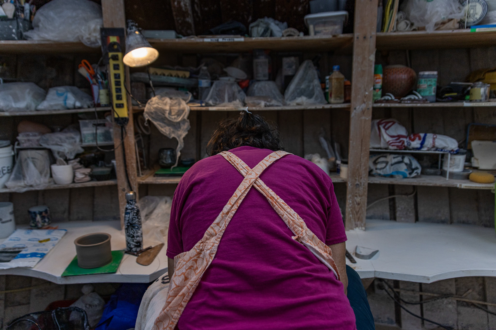 Beatriz Pinto molds clay at a wheel in the Glen Echo Pottery studio in Glen Echo, Md. on Sept. 28, 2025.