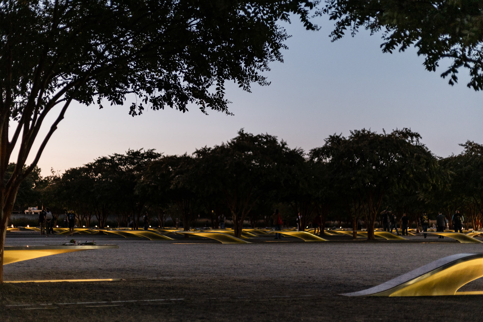 ARLINGTON, VIRGINIA - SEPTEMBER 11: Illuminated benches are spread throughout the 9/11 Pentagon Memorial on Sept. 11, 2025. The site, completed in 2008, consists of 184 benches dedicated to a victim of the attack arranged by age and pointing toward either the Pentagon or the flight path.