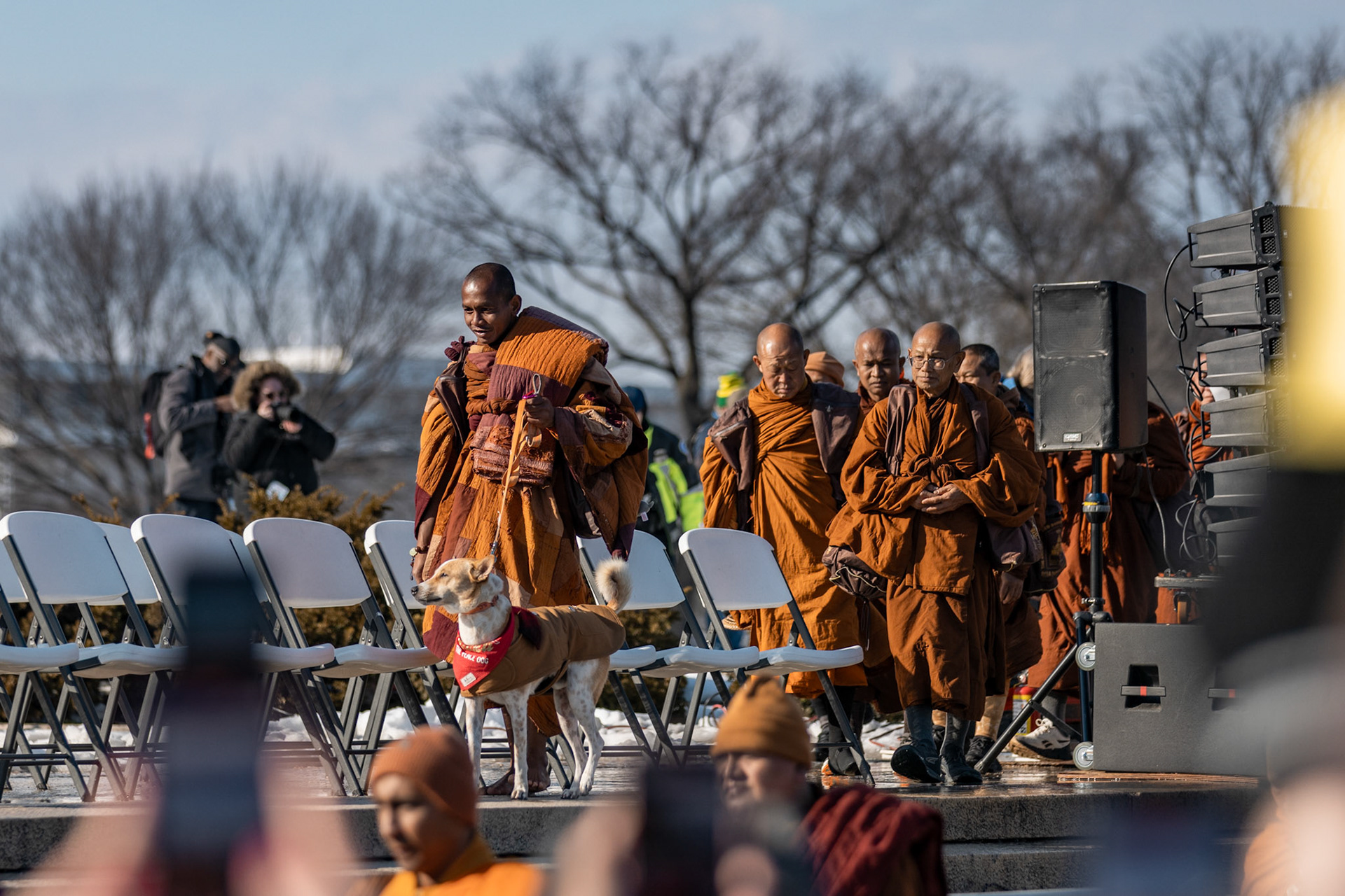 Buddhist monks walk onto stage for their final remarks in front of the Lincoln Memorial in Washington, D.C. on Feb. 11, 2026. A group of 18 monks began their march to raise awareness of “peace, loving kindness and compassion” in the United States and the world on Oct. 26 in Fort Worth, Texas, ending with their arrival in the nation's capital.