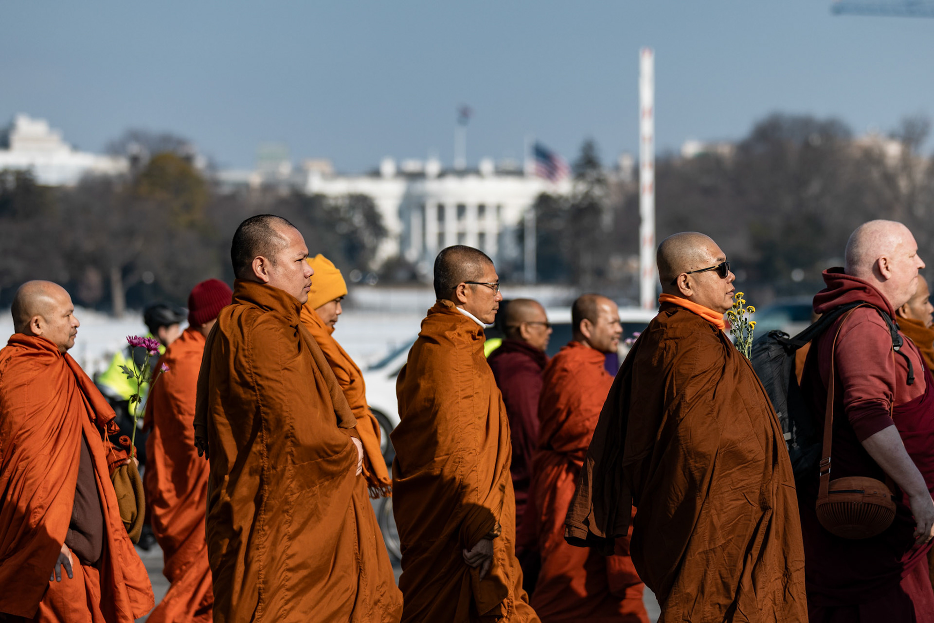 Buddhist monks walk past the White House during the March for Peace to greet U.S. Congress members on day 109 of their journey on Feb. 11, 2026 in Washington, D.C.. A group of 18 monks began their march to raise awareness of “peace, loving kindness and compassion” in the United States and the world on Oct. 26 in Fort Worth, Texas, ending with their arrival in the nation's capital.