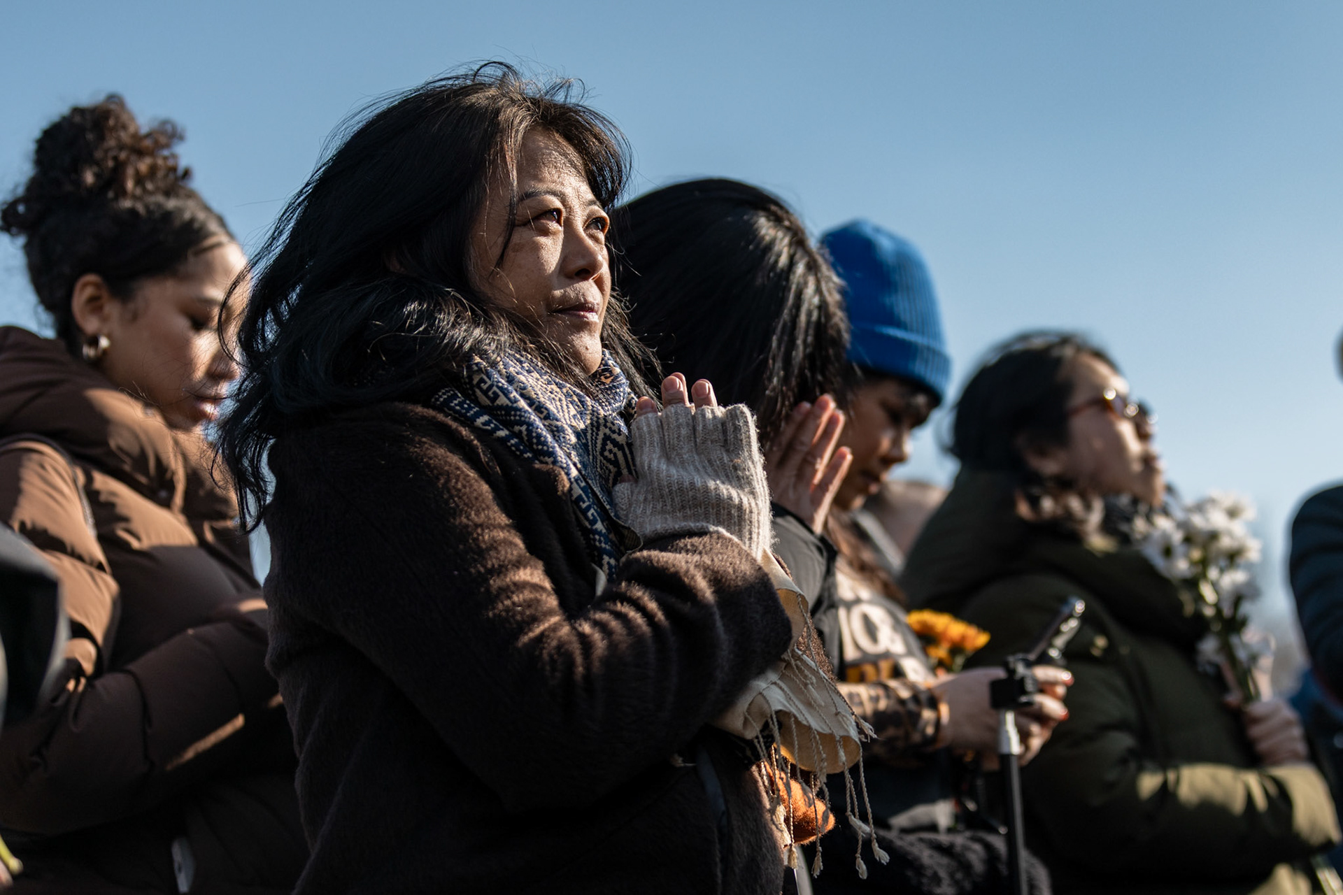 A demonstrator prays in front of the Lincoln Memorial as Buddhist monks gather for their final remarks on Feb. 11, 2026. A group of 18 monks began their march to raise awareness of “peace, loving kindness and compassion” in the United States and the world on Oct. 26 in Fort Worth, Texas, ending with their arrival in the nation's capital.