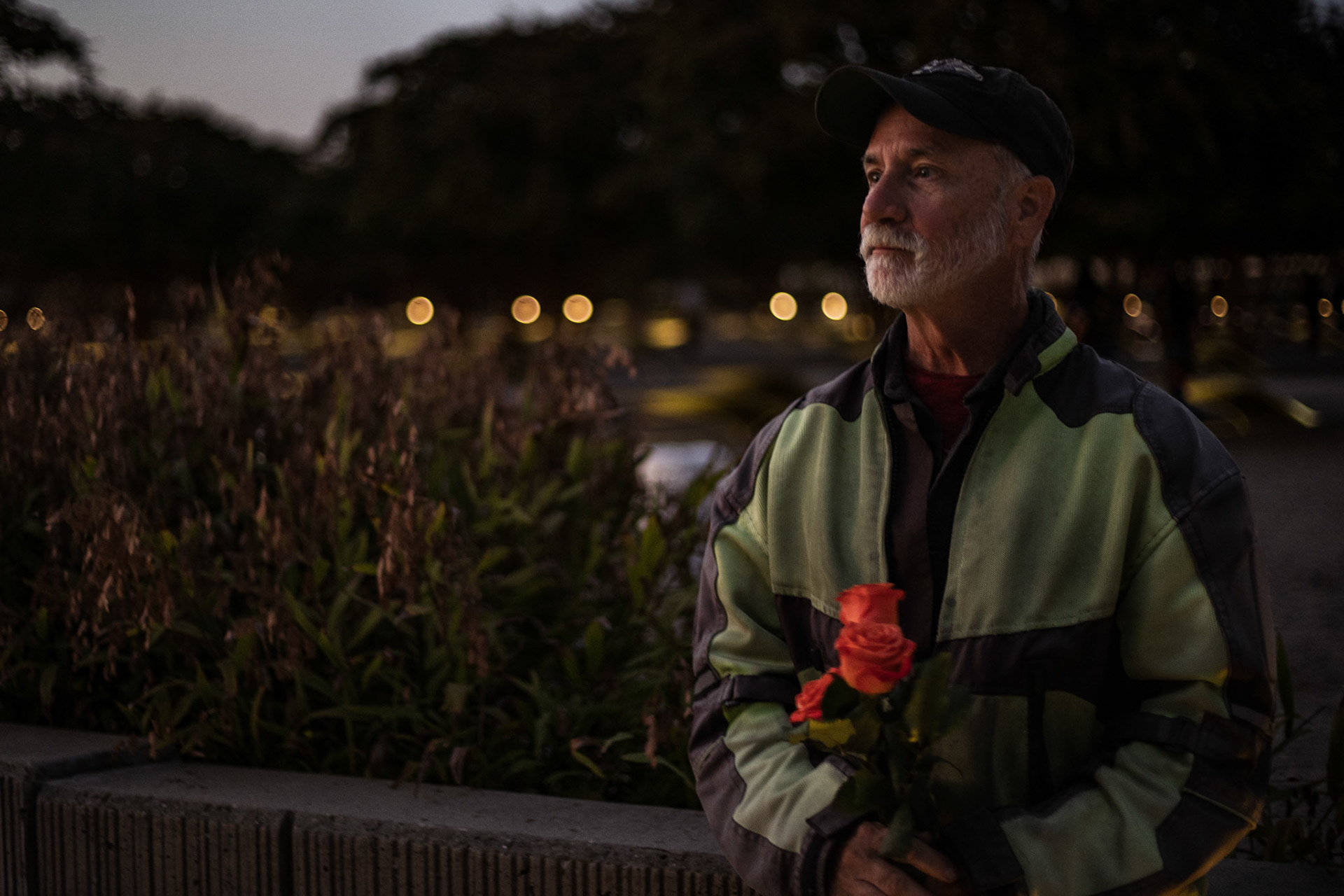 ARLINGTON, VIRGINIA - SEPTEMBER 11: Stan Harris, a biker in the Christian Motorcyclists Association, holds roses to place on the tribute benches at the Pentagon Memorial on Sept. 11, 2025. Each year, his group along with other motorcyclist groups from throughout the area gather at the memorial for a ceremony to honor the victims of the attack.