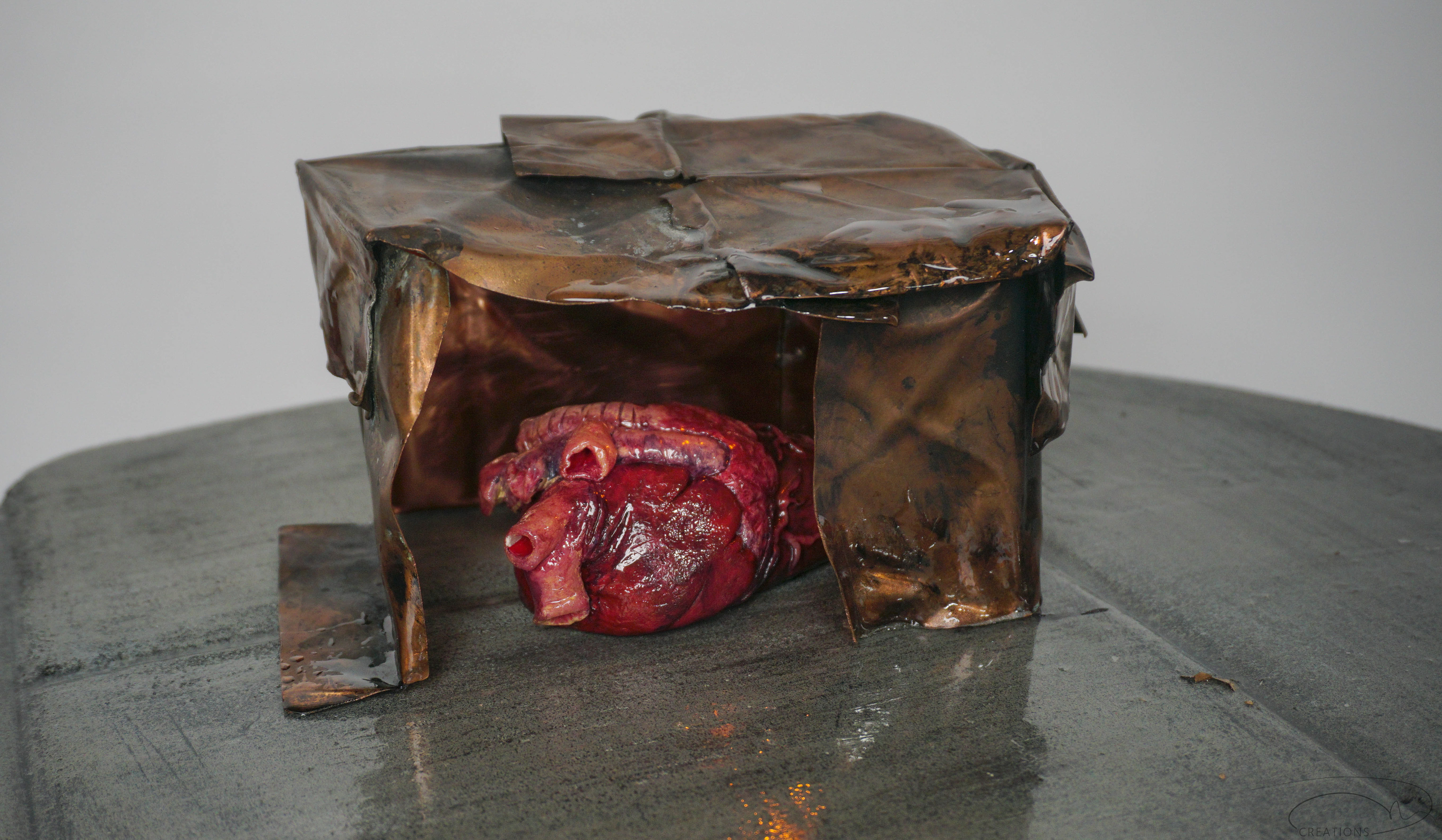 Copper 'Home' bent and manipulated to look like cardboard.