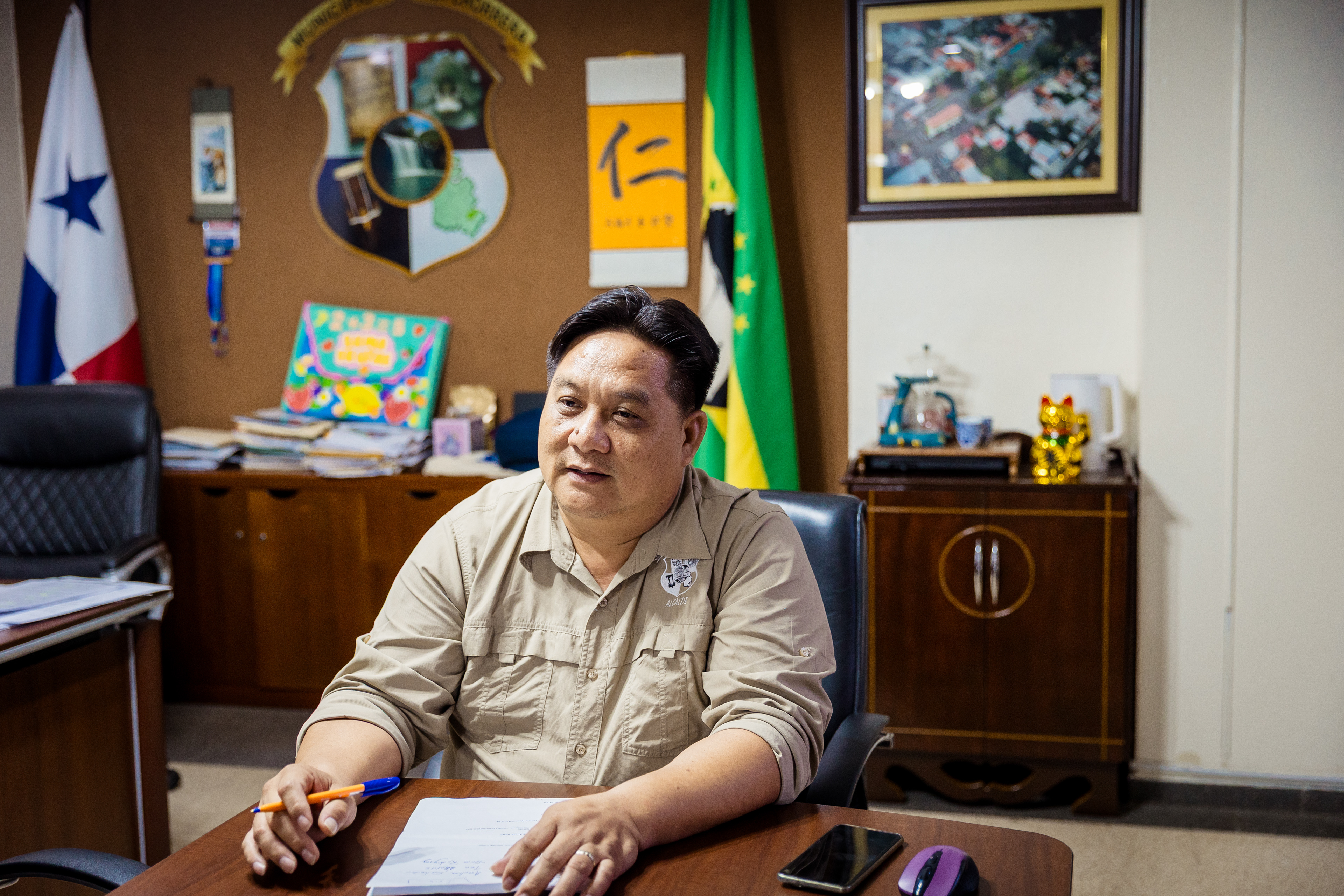 La Chorrera Mayor Eloy Chong in his office, where he keeps boxes of mandarin-peel tea and red-wrapped Chinese candies beside his desk for visitors.