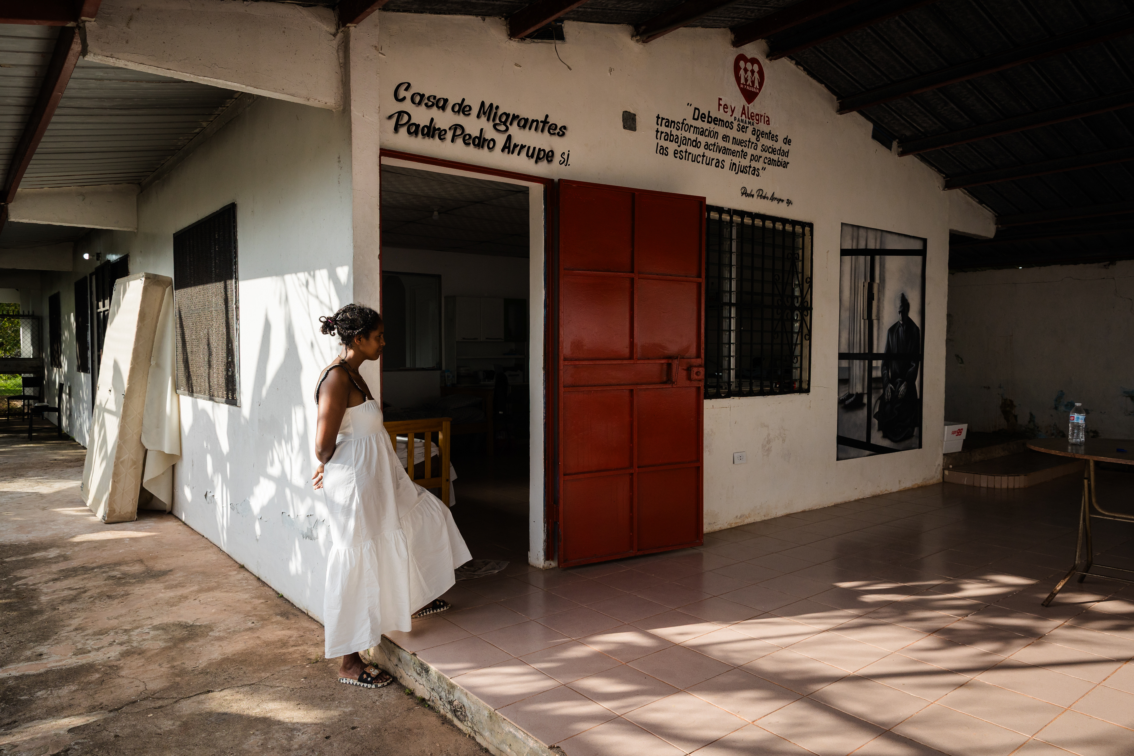 A migrant woman stands by the door of a dormitory at Fe y Alegría, a center providing shelter and assistance to those deported from the United States under the Trump administration's mass deportation efforts. March 26, 2025, Panama City, Panama.