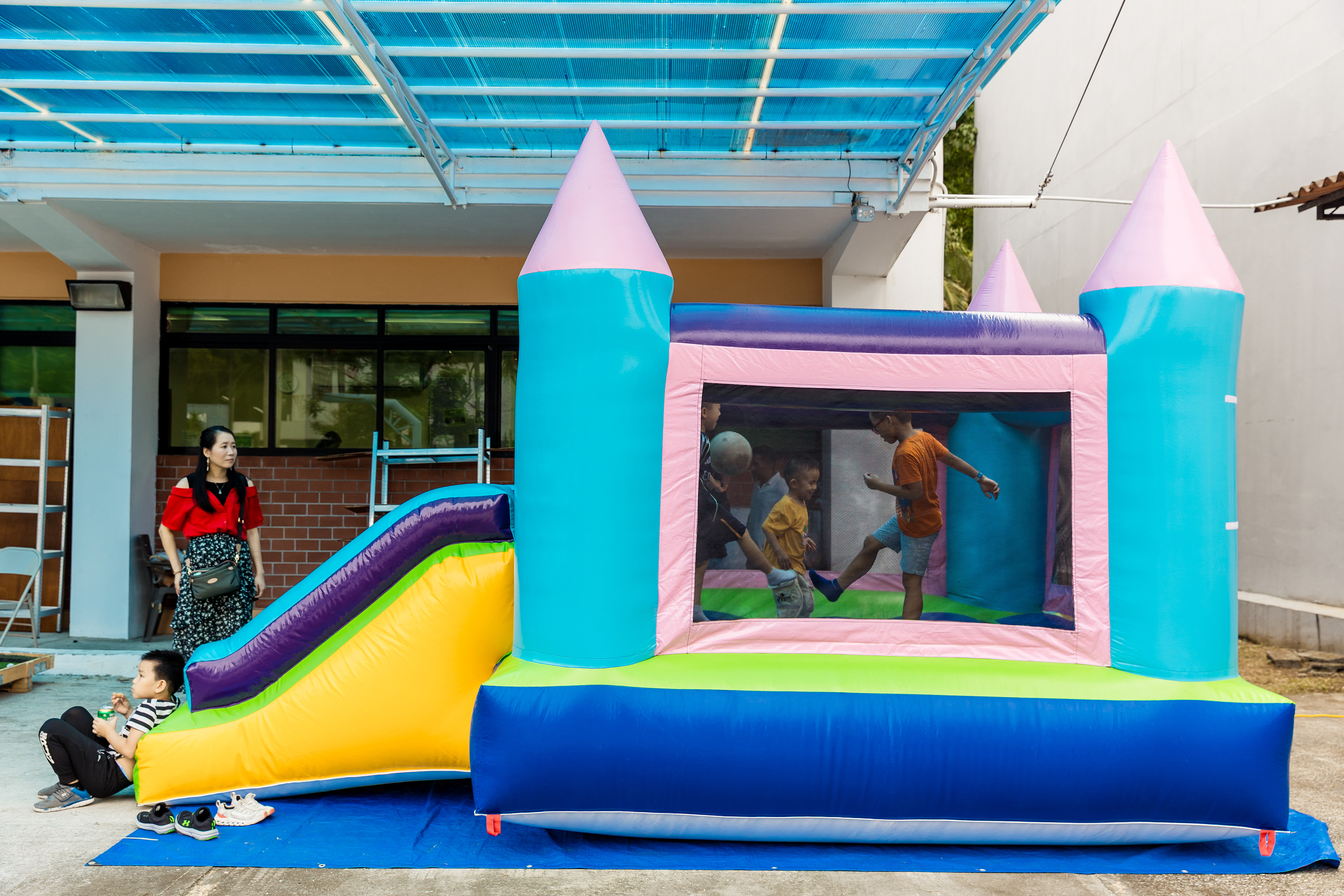 Children play in a bounce castle at a family fair hosted by the Chinese Evangelical Church of Panama in Panama City, on July 20.