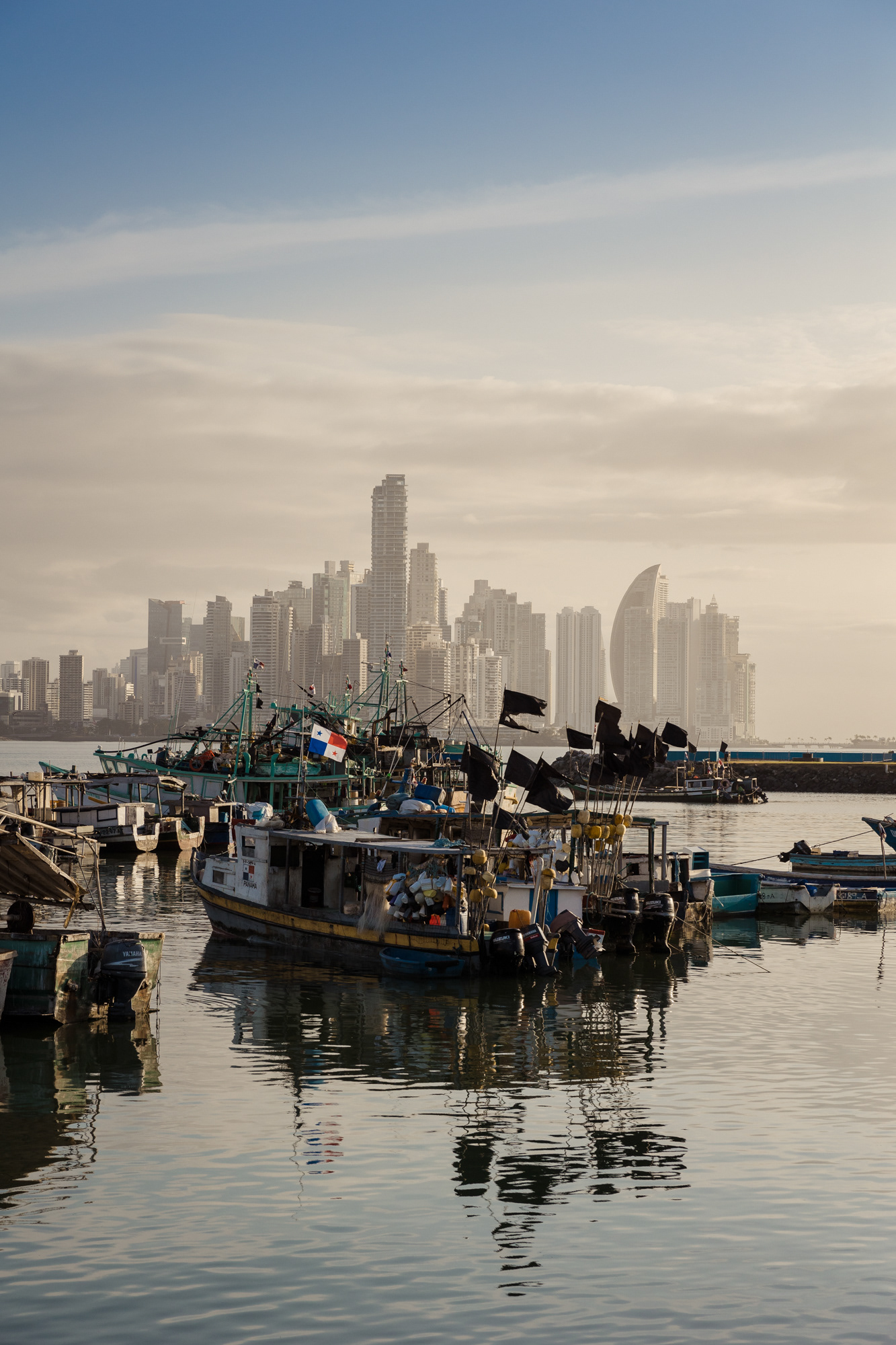Artisan fishing boats at the Mercado de Mariscos stand in contrast to Panama City’s towering skyline.