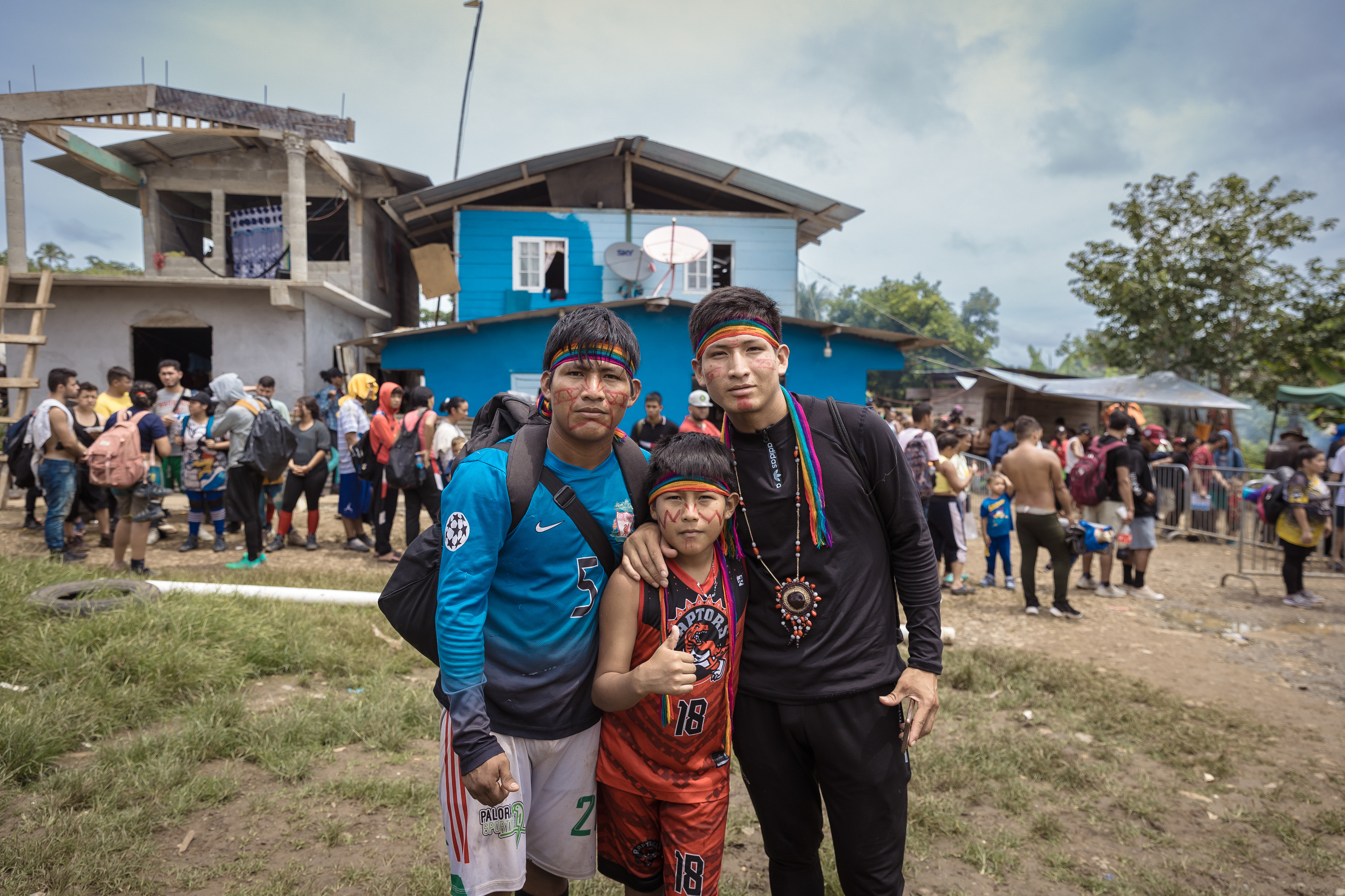 An Ecuadorian migrant family poses in Bajo Chiquito, the first community migrants reach after the Darién Gap.