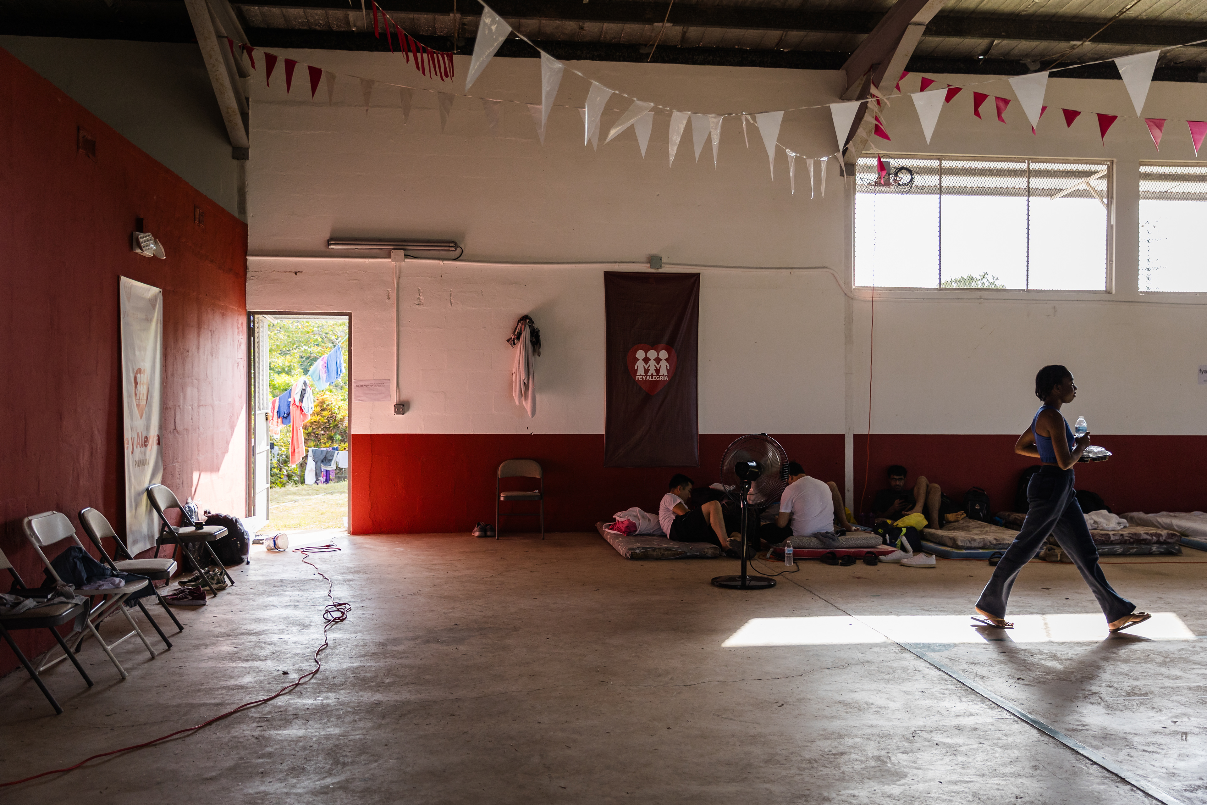 Migrants rest on their mattresses and gather at Fe y Alegría, a center that has provided support for displaced individuals since 2017. All were deported from the United States under the Trump administration's mass deportation efforts. March 26, 2025, Panama City, Panama.