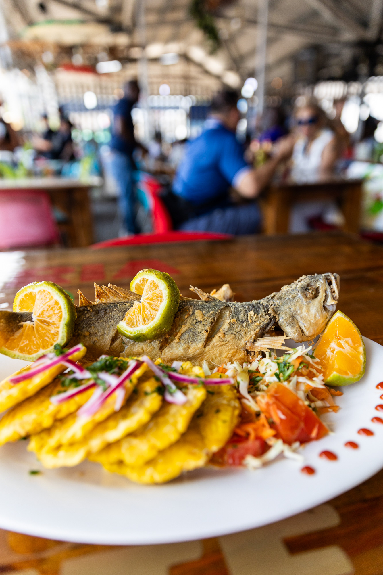 Corvina dish at Restaurant La Promesa in Mercado de Mariscos, bringing the freshest catch to the table.