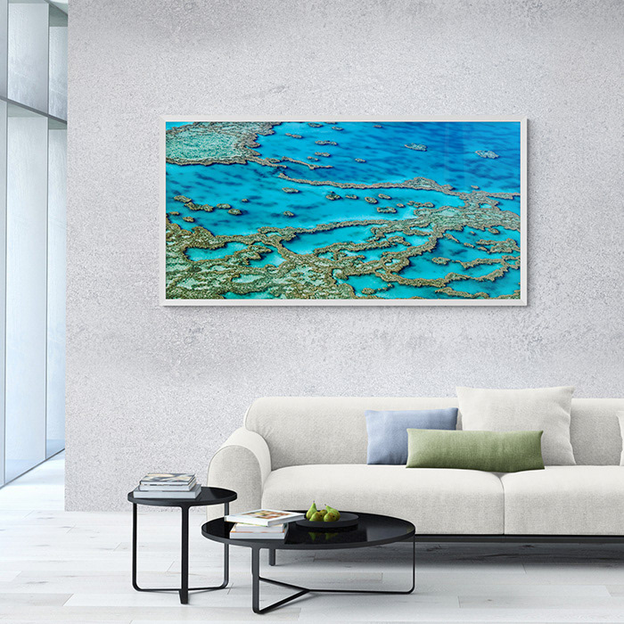 An archive quality fine art photographic print of photographer Markham Lane's image Lassiter's Reef Aerial Landscape hangs on a wall with print dimensions of 160 centimetres across by 80 centimetres tall.