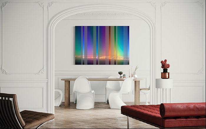 A high resolution metallic pearl fine art photographic print of photographer Markham Lane's digitally altered aerial photo Double Polarised Aerial View From 15,000 Feet, hangs on the wall of a modern dining room.