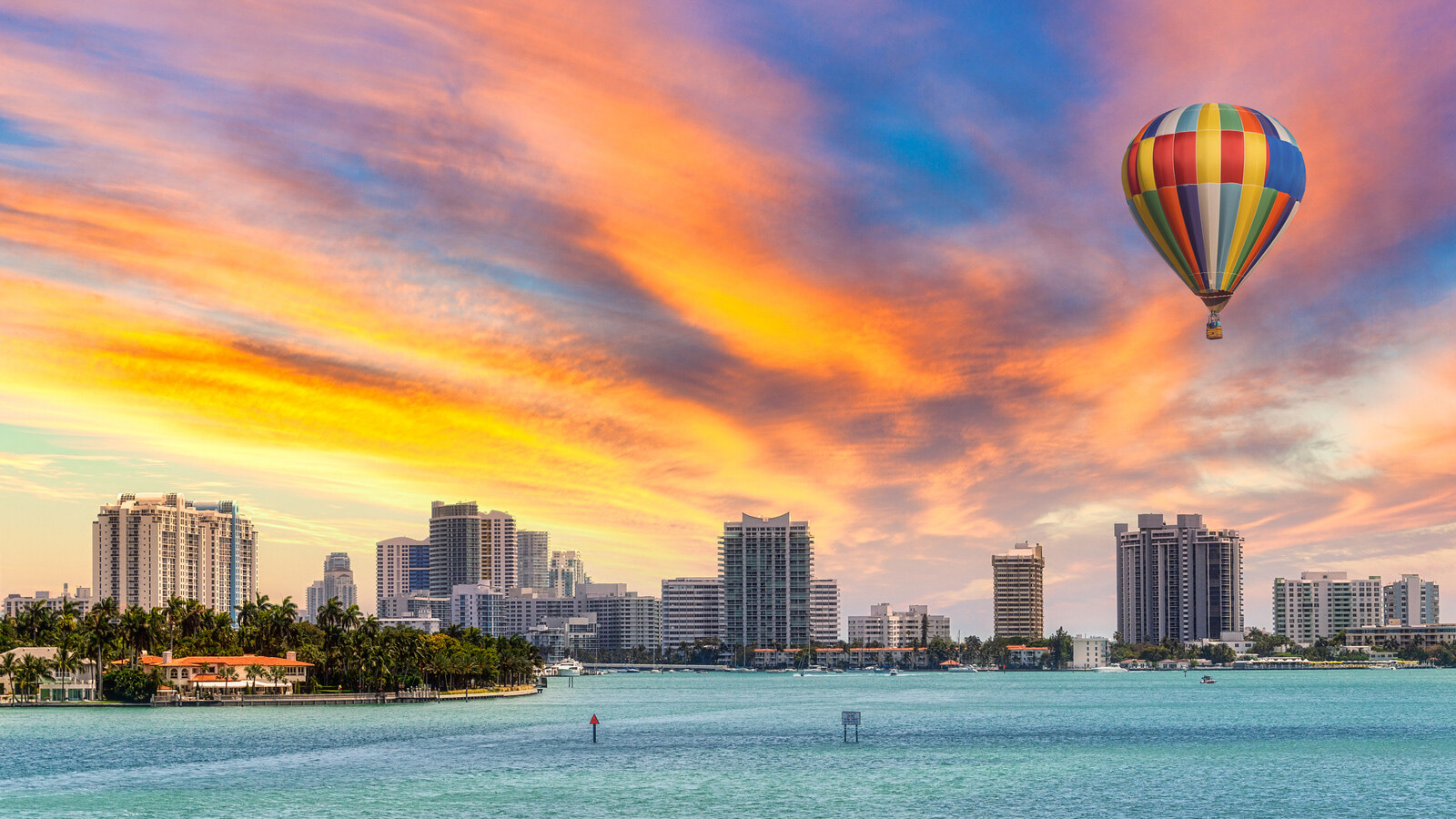 Sky replacement and hot air balloon over Miami city skyline, USA