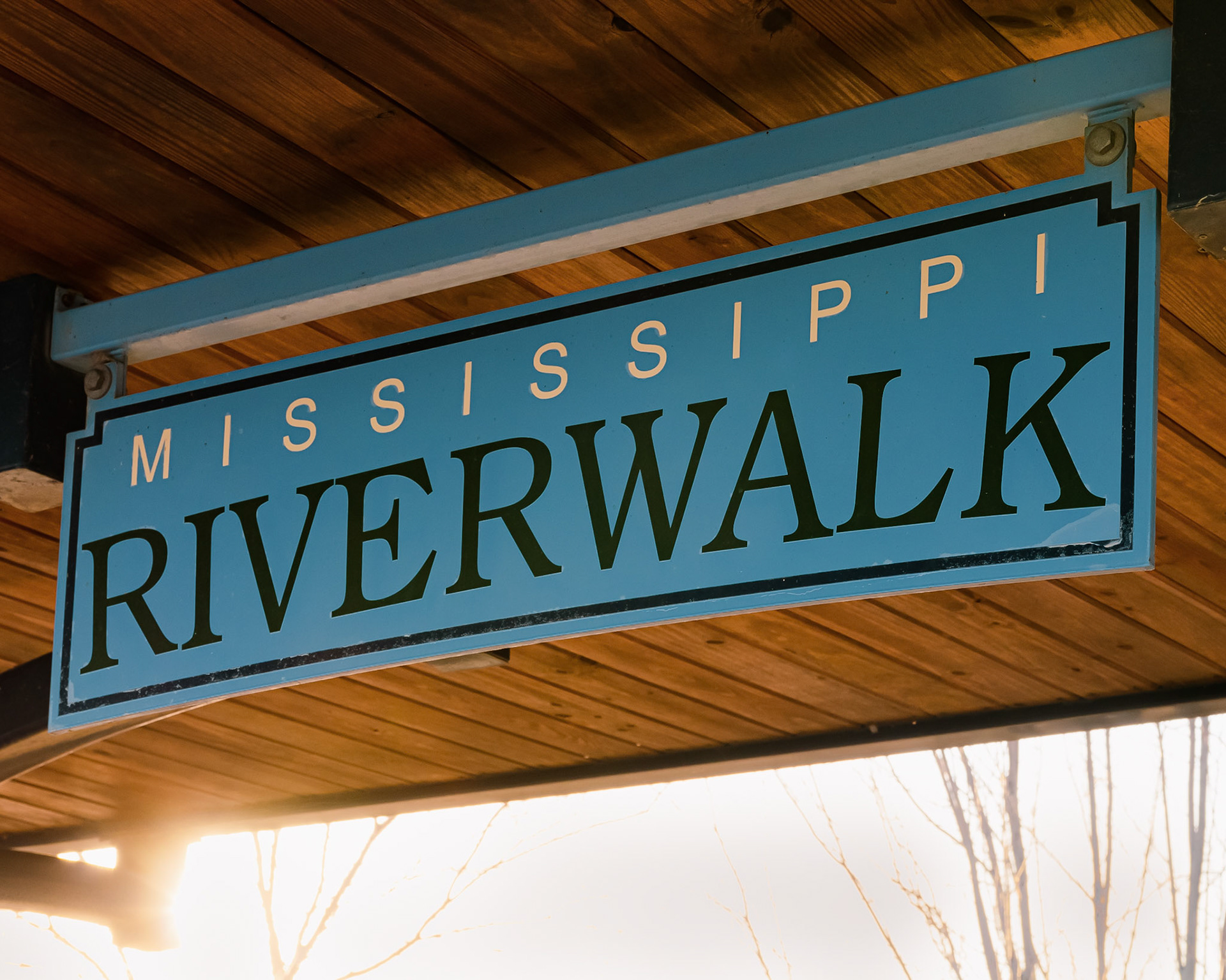 Mississippi Riverwalk sign on the Mississippi River.