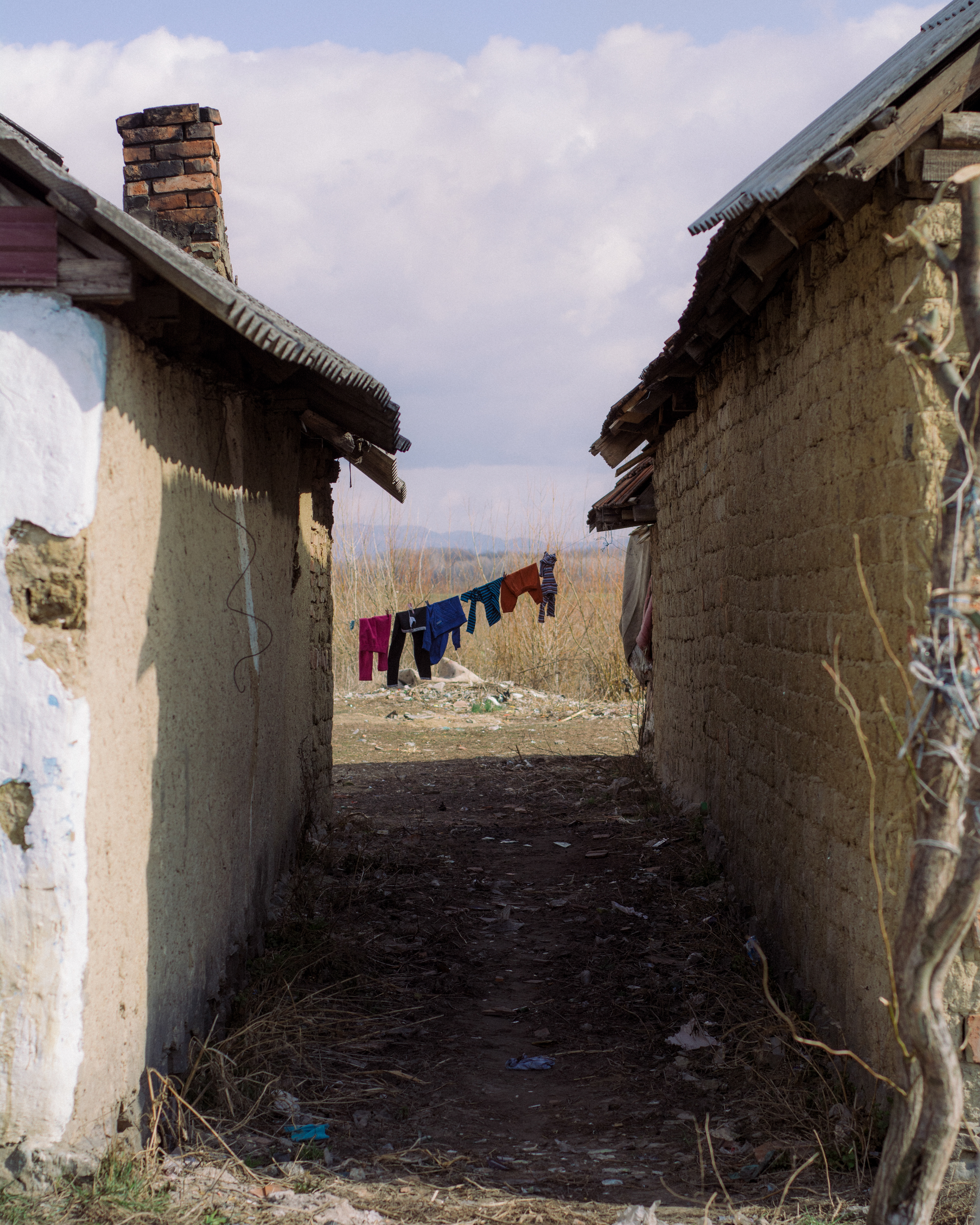 Clothesline between two homes. Ukraine, 2019.
