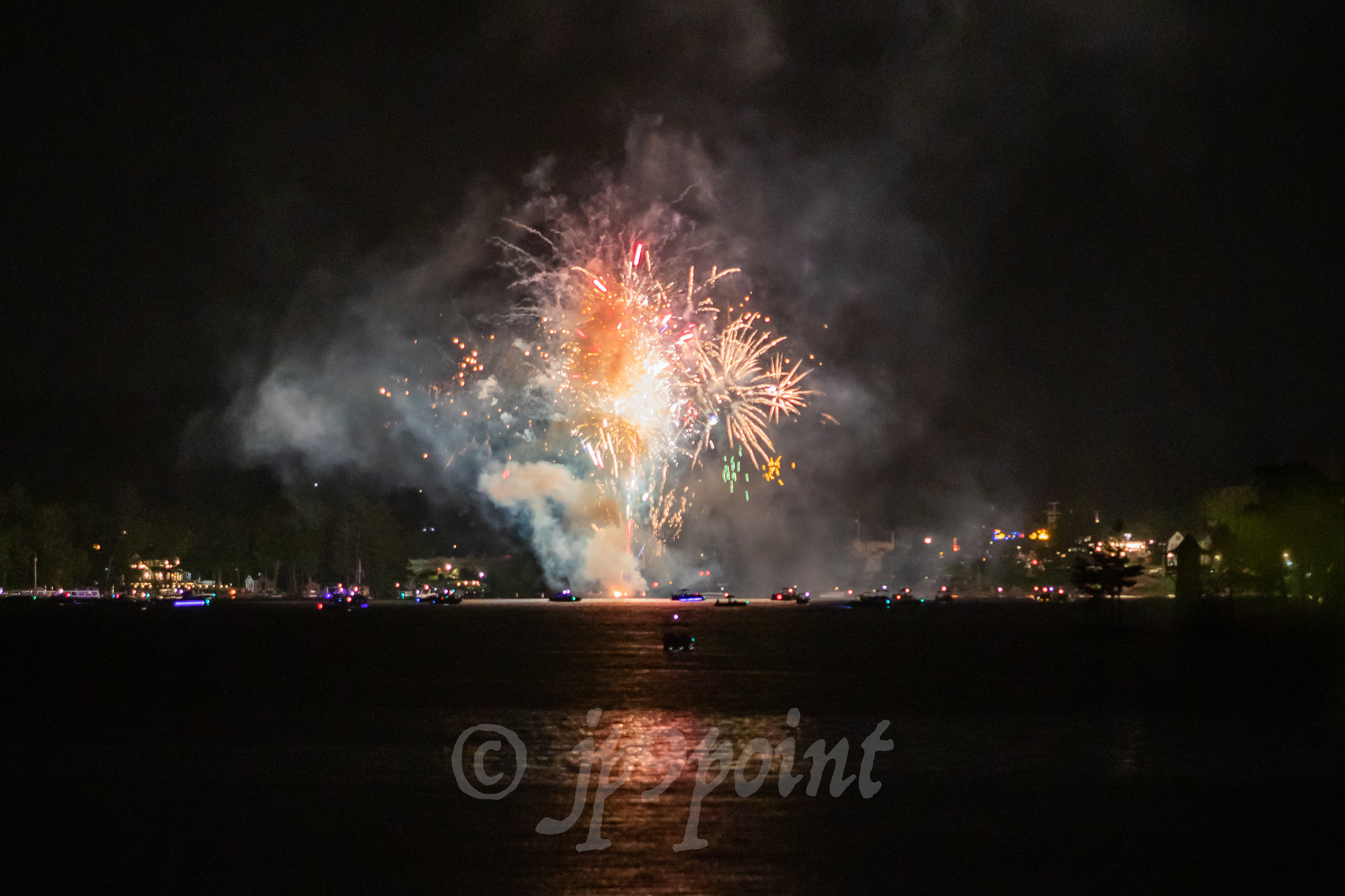 Colorful fireworks over Weirs Beach, New Hampshire.