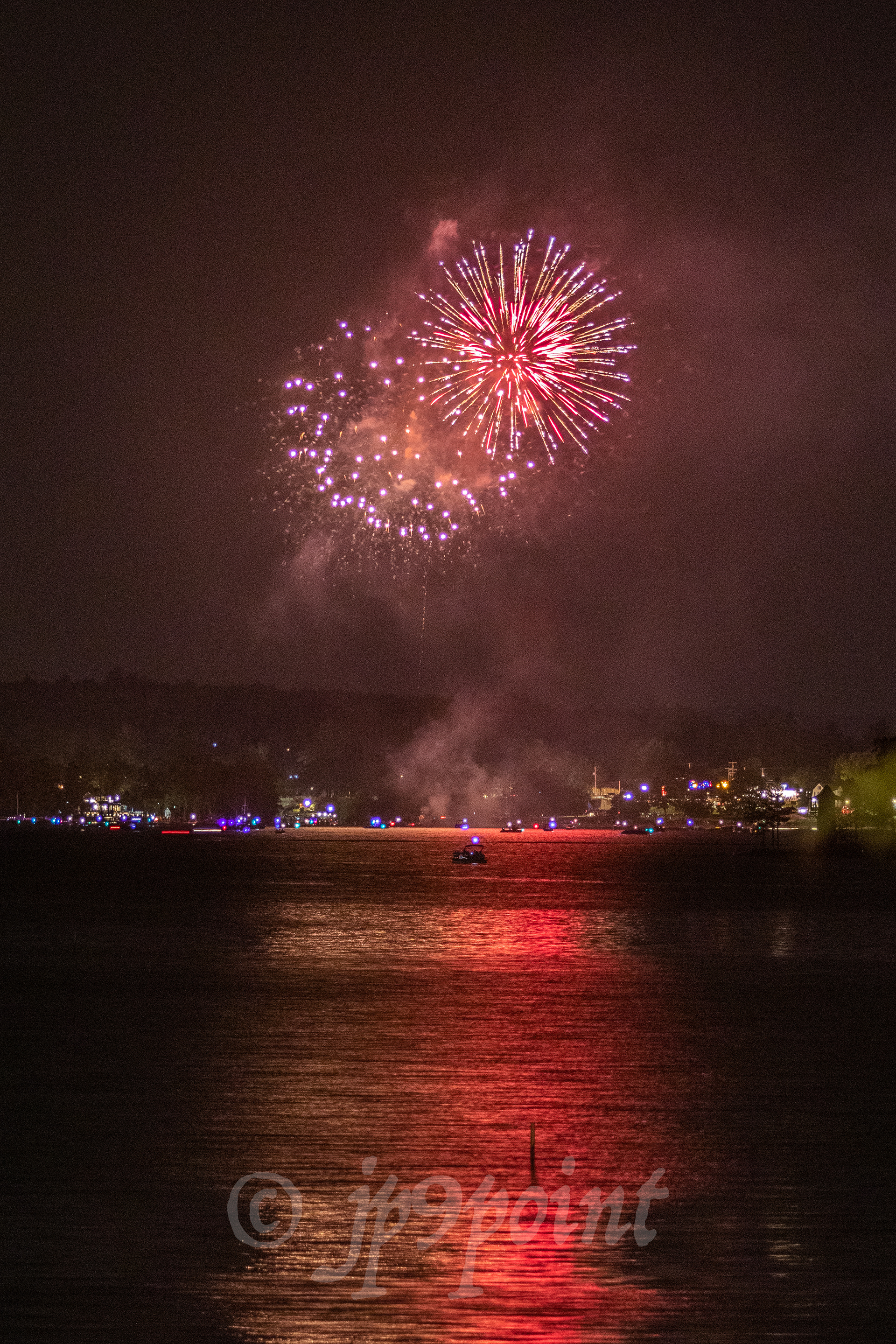 Colorful fireworks over Weirs Beach, New Hampshire.