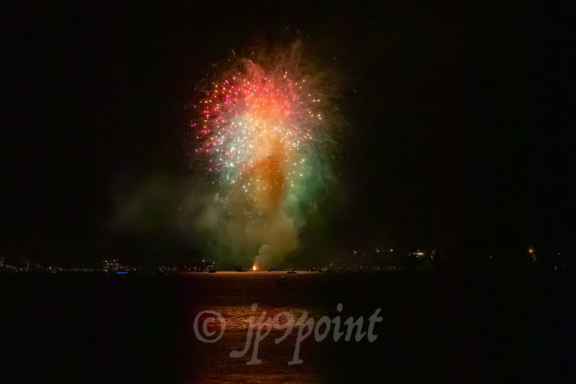 Colorful fireworks over Weirs Beach, New Hampshire.