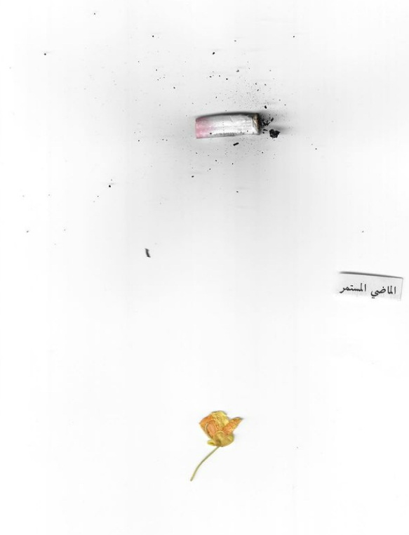 Detail (text collage and found object) — Text in image (Arabic → English): 'The continuous past'