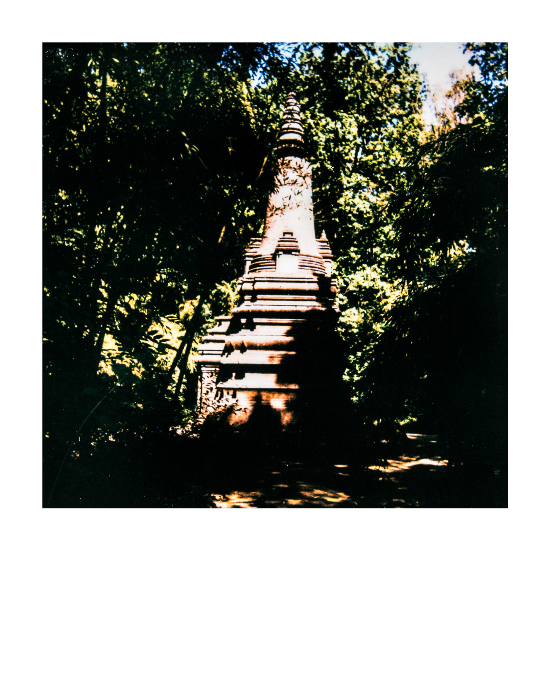 Stupa monuments aux morts Cambodgiens et Laotiens, Jardin d'agronomie tropicale René Dumont, Paris, Ile-de-France, France, 2026 (Polaroid)